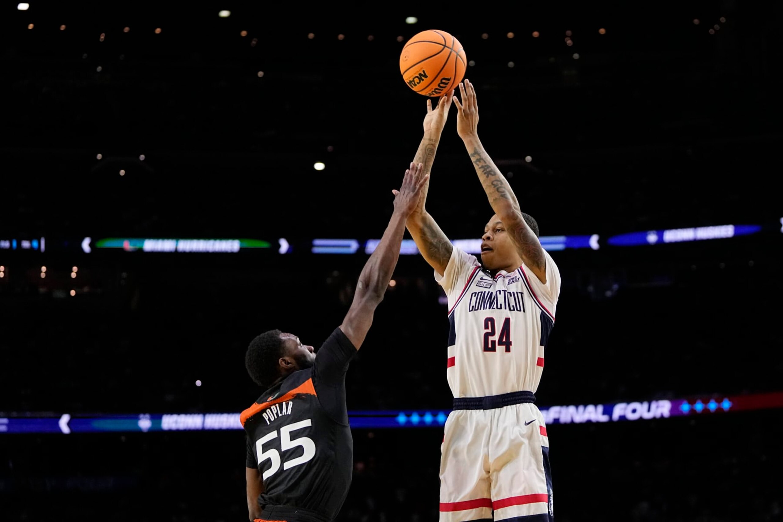 Connecticut guard Jordan Hawkins shoots over Miami guard Wooga Poplar during the first half of a Final Four college basketball game in the NCAA Tournament on Saturday, April 1, 2023, in Houston. (AP Photo/David J. Phillip) Connecticut guard Jordan Hawkins shoots over Miami guard Wooga Poplar during the first half of a Final Four college basketball game in the NCAA Tournament on Saturday, April 1, 2023, in Houston. (AP Photo/David J. Phillip)