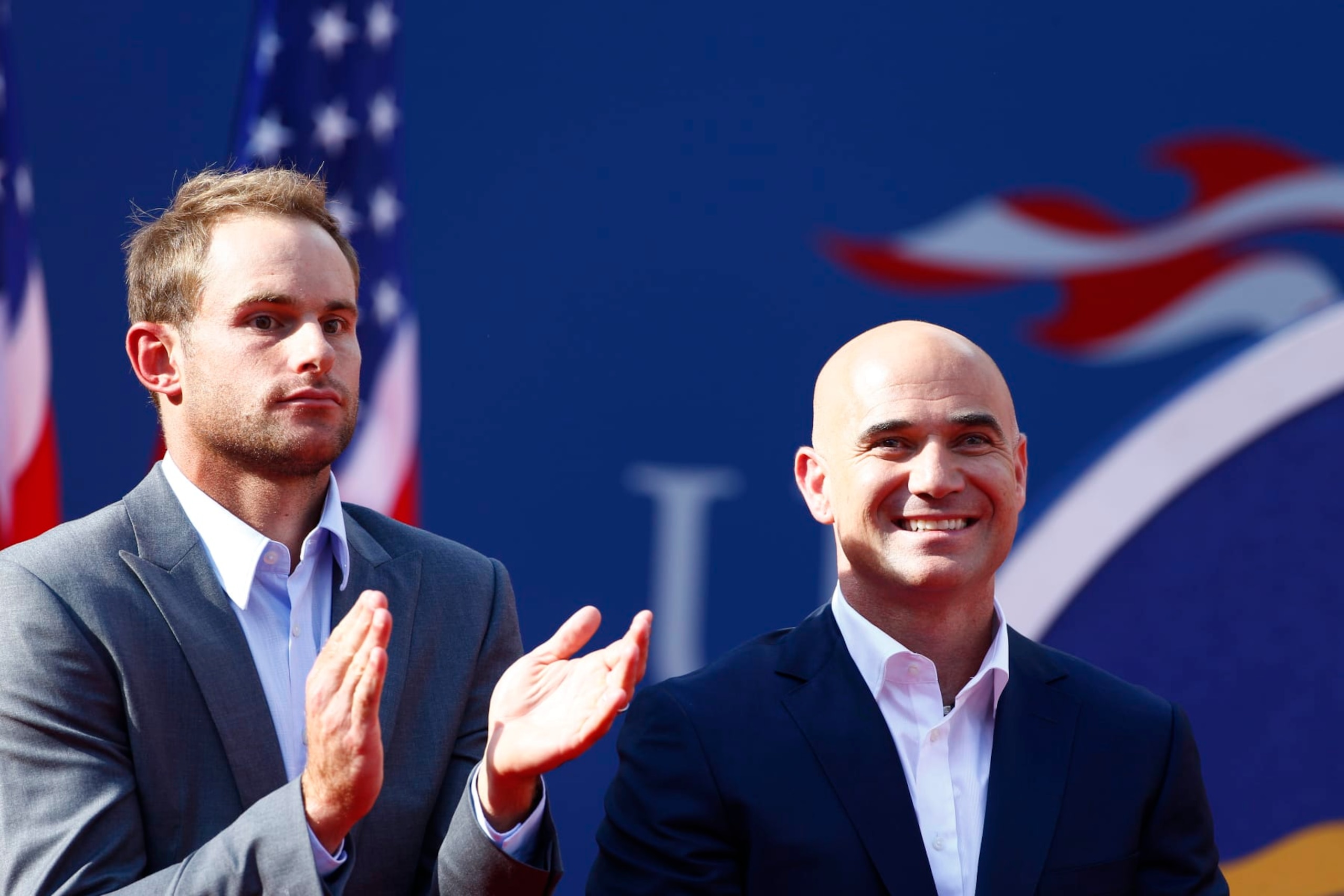 Andy Roddick, (left) with Andre Agassi during his induction Into US Open Court of Champions during the US Open Tennis Tournament, Flushing, New York. USA. 9th September 2012. Photo Tim Clayton (Photo by Tim Clayton/Corbis via Getty Images) Andy Roddick, (left) with Andre Agassi during his induction Into US Open Court of Champions during the US Open Tennis Tournament, Flushing, New York. USA. 9th September 2012. Photo Tim Clayton (Photo by Tim Clayton/Corbis via Getty Images)