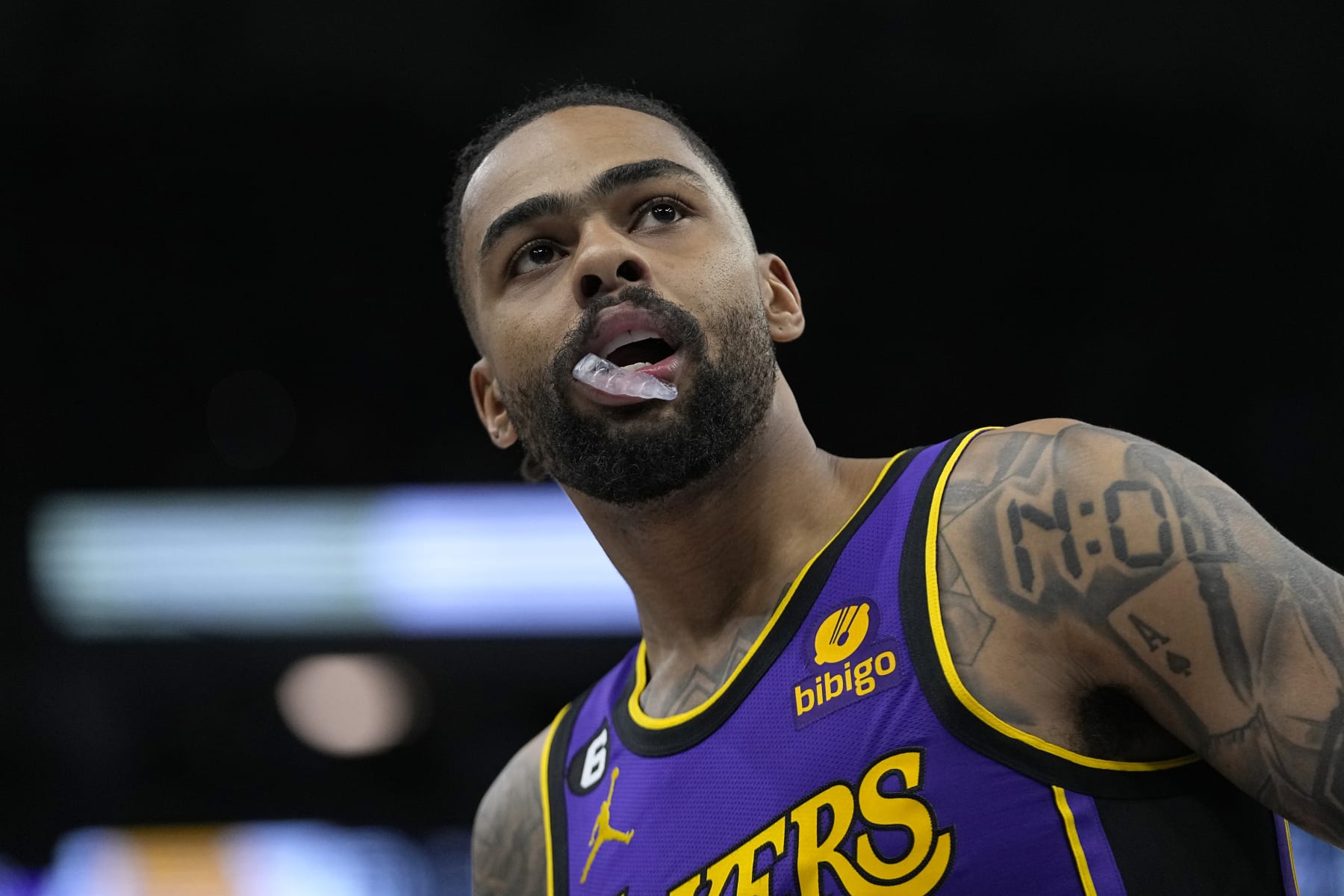 Los Angeles Lakers guard D'Angelo Russell looks on during the first half of an NBA basketball game against the Minnesota Timberwolves, Friday, March 31, 2023, in Minneapolis. (AP Photo/Abbie Parr)