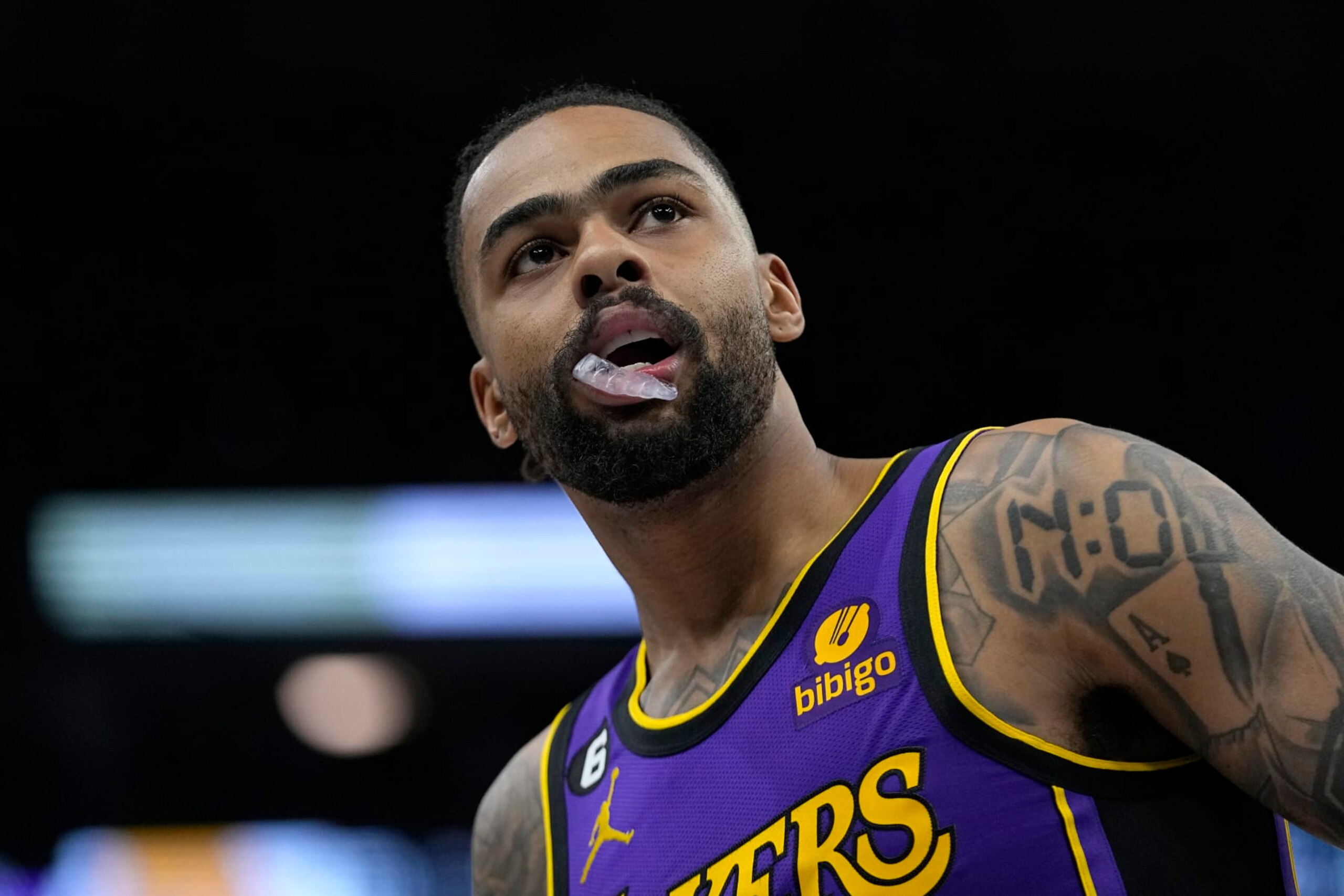 Los Angeles Lakers guard D'Angelo Russell looks on during the first half of an NBA basketball game against the Minnesota Timberwolves, Friday, March 31, 2023, in Minneapolis. (AP Photo/Abbie Parr)