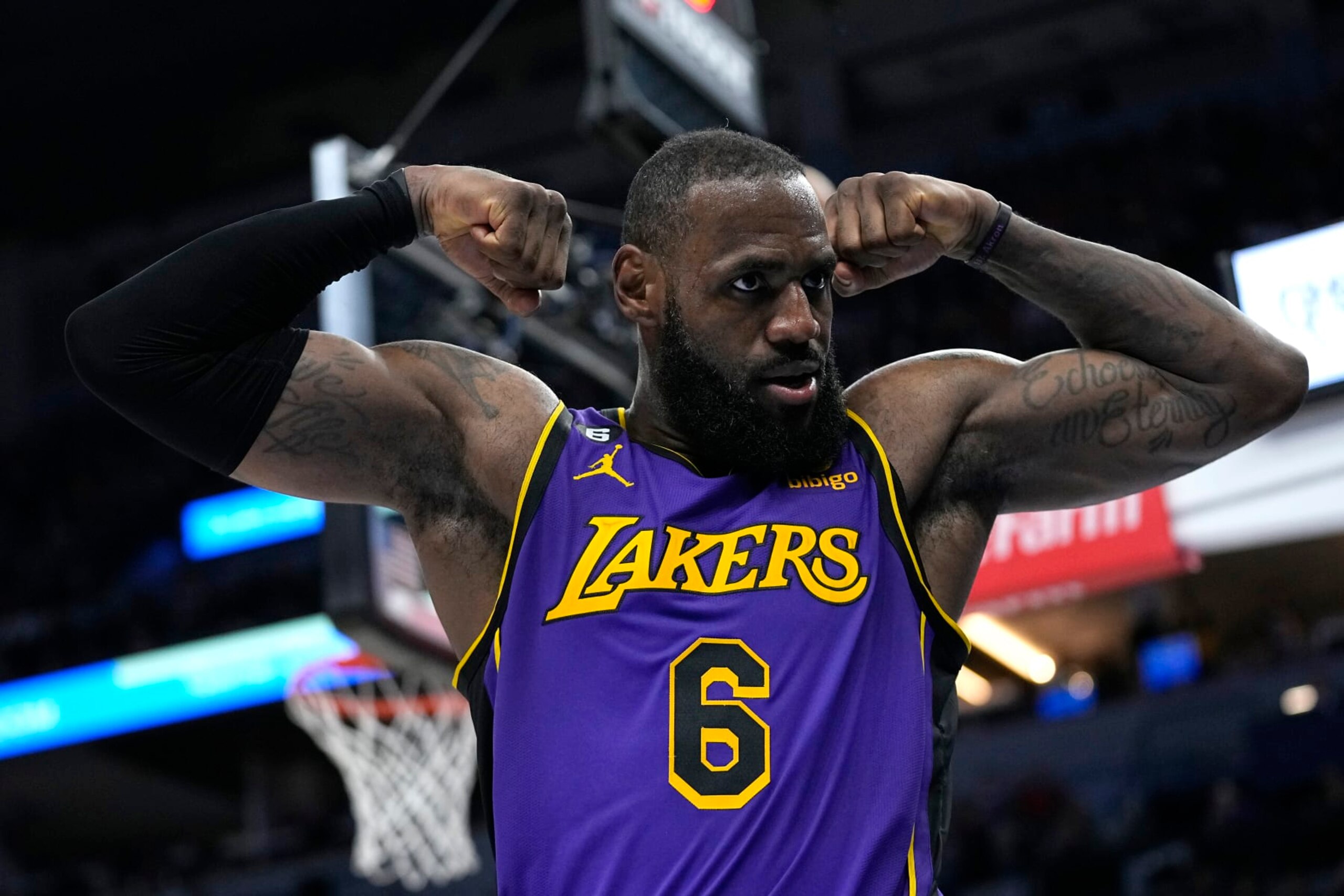 Los Angeles Lakers forward LeBron James (6) celebrates after making a basket while fouled during the second half of an NBA basketball game against the Minnesota Timberwolves, Friday, March 31, 2023, in Minneapolis. (AP Photo/Abbie Parr)