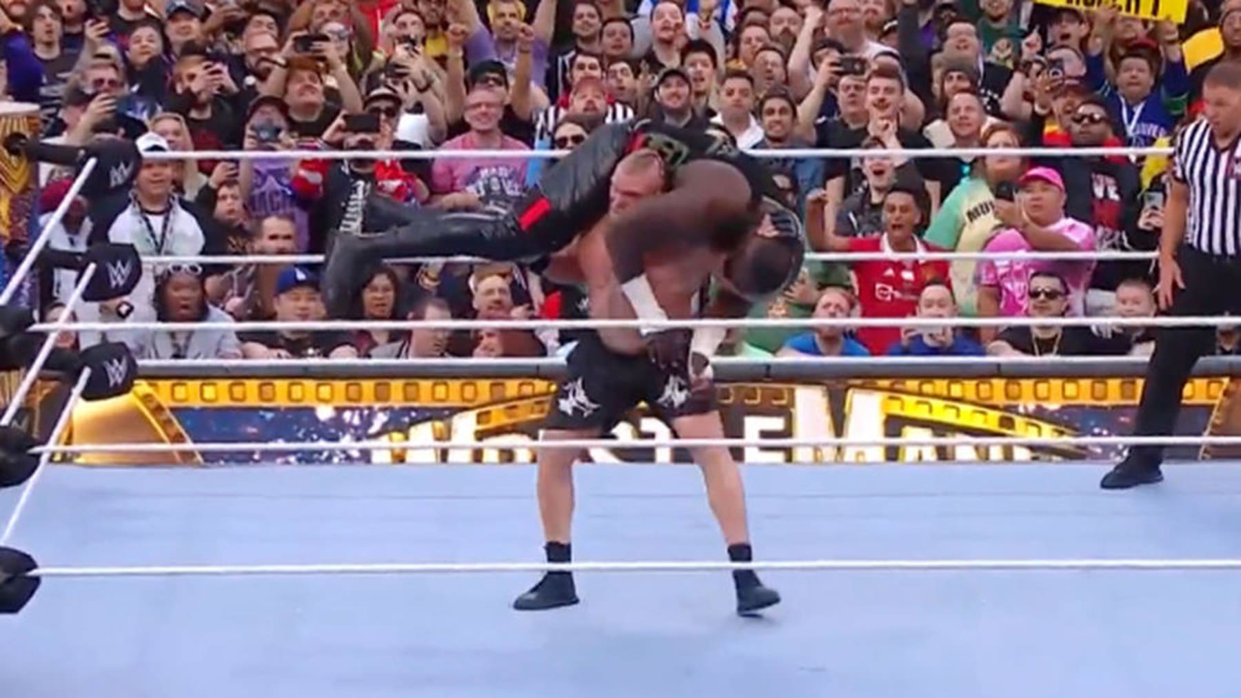 Brock Lesnar and Omos.