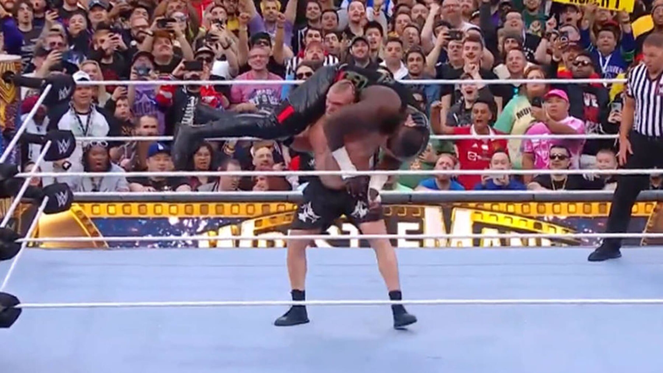 Brock Lesnar and Omos.