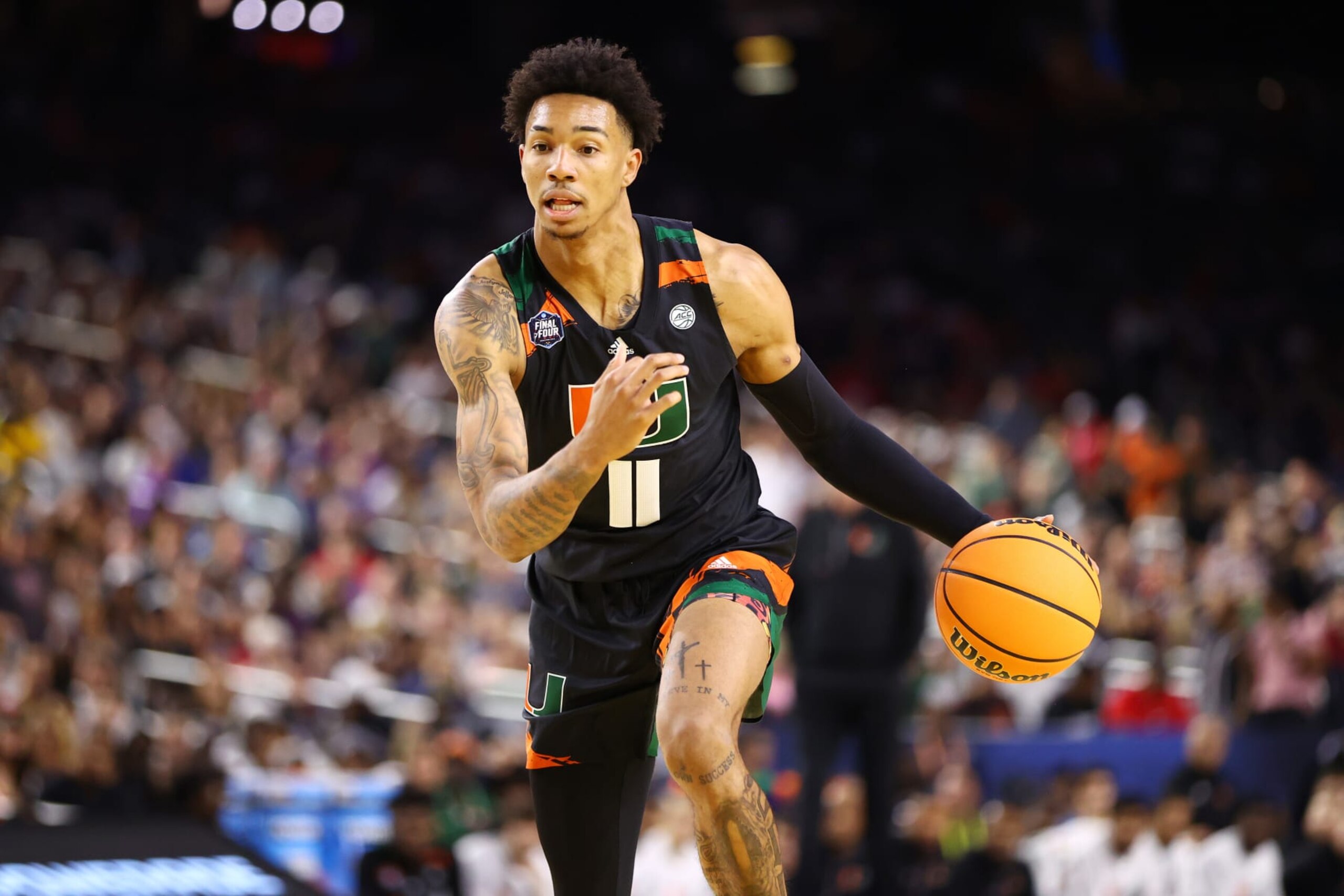 HOUSTON, TEXAS - APRIL 01: Jordan Miller #11 of the Miami Hurricanes dribbles the ball against the Connecticut Huskies during the NCAA Men’s Basketball Tournament Final Four semifinal game at NRG Stadium on April 01, 2023 in Houston, Texas. (Photo by Jamie Schwaberow/NCAA Photos via Getty Images) HOUSTON, TEXAS - APRIL 01: Jordan Miller #11 of the Miami Hurricanes dribbles the ball against the Connecticut Huskies during the NCAA Men’s Basketball Tournament Final Four semifinal game at NRG Stadium on April 01, 2023 in Houston, Texas. (Photo by Jamie Schwaberow/NCAA Photos via Getty Images)