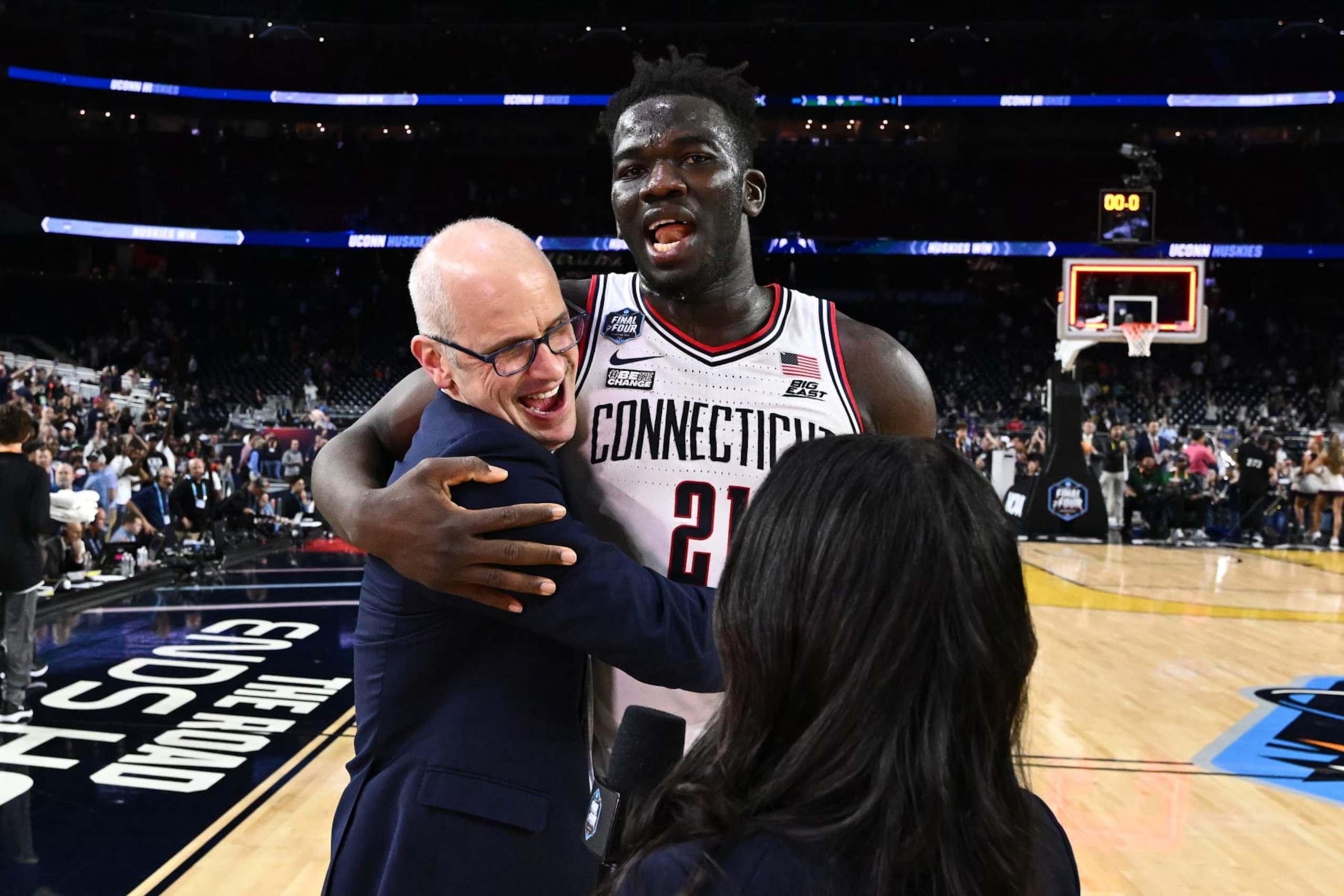 HOUSTON, TEXAS - APRIL 01: Head coach Dan Hurley of the Connecticut Huskies talks with Adama Sanogo #21 after defeating the Miami (Fl) Hurricanes during the NCAA Men’s Basketball Tournament Final Four semifinal game at NRG Stadium on April 01, 2023 in Houston, Texas. (Photo by Brett Wilhelm/NCAA Photos via Getty Images) HOUSTON, TEXAS - APRIL 01: Head coach Dan Hurley of the Connecticut Huskies talks with Adama Sanogo #21 after defeating the Miami (Fl) Hurricanes during the NCAA Men’s Basketball Tournament Final Four semifinal game at NRG Stadium on April 01, 2023 in Houston, Texas. (Photo by Brett Wilhelm/NCAA Photos via Getty Images)