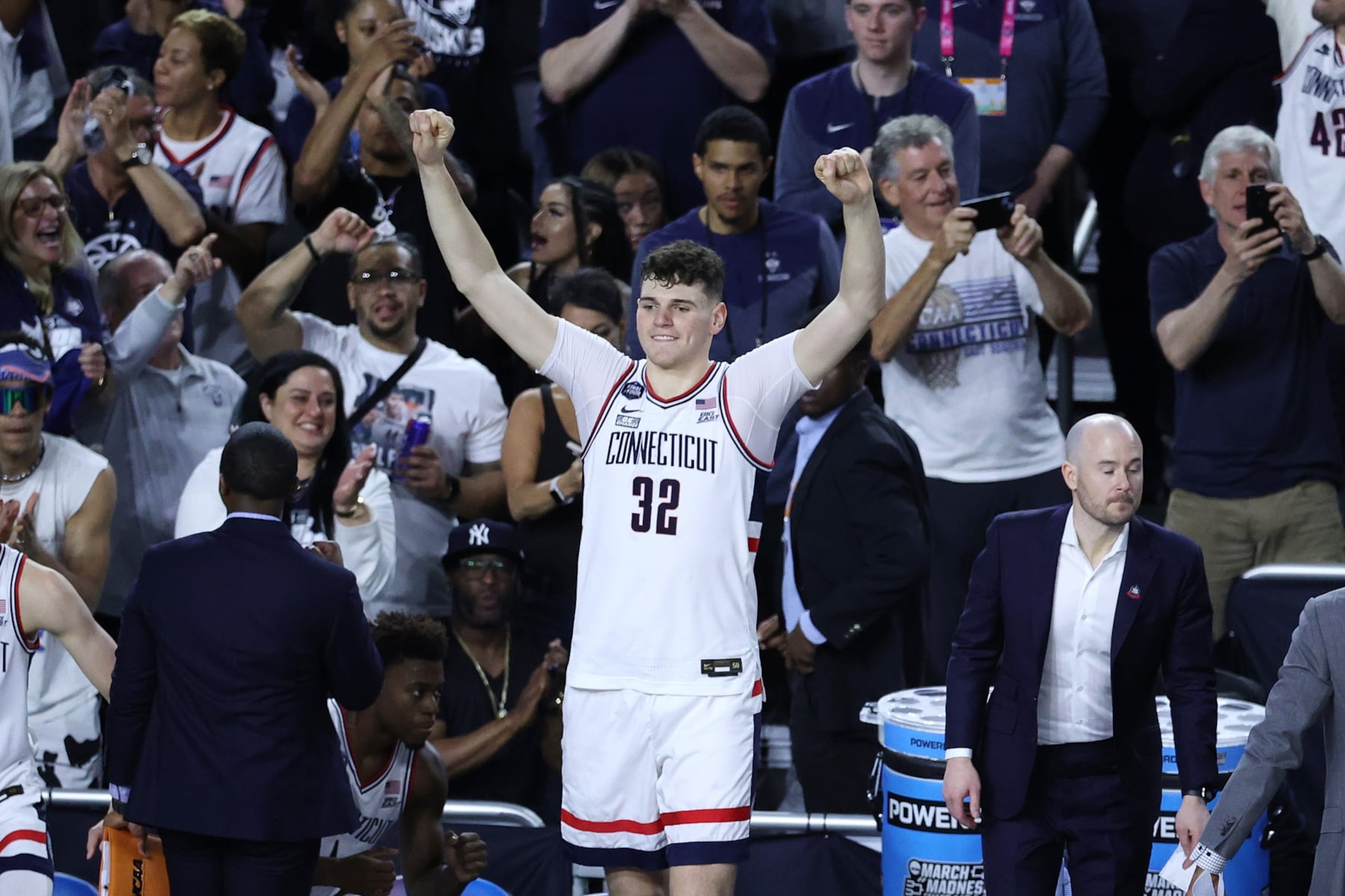HOUSTON, TEXAS - APRIL 01: Donovan Clingan #32 of the Connecticut Huskies celebrates after defeating the Miami (Fl) Hurricanes during the NCAA Men’s Basketball Tournament Final Four semifinal game at NRG Stadium on April 01, 2023 in Houston, Texas. (Photo by Tyler Schank/NCAA Photos via Getty Images)