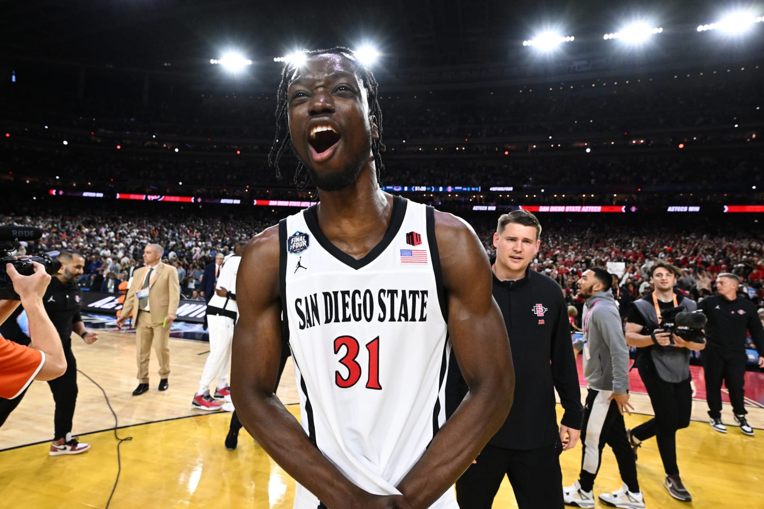HOUSTON, TEXAS - APRIL 01: Nathan Mensah #31 of the San Diego State Aztecs reacts after defeating the Florida Atlantic Owls during the NCAA Men’s Basketball Tournament Final Four semifinal game at NRG Stadium on April 01, 2023 in Houston, Texas. (Photo by Brett Wilhelm/NCAA Photos via Getty Images)