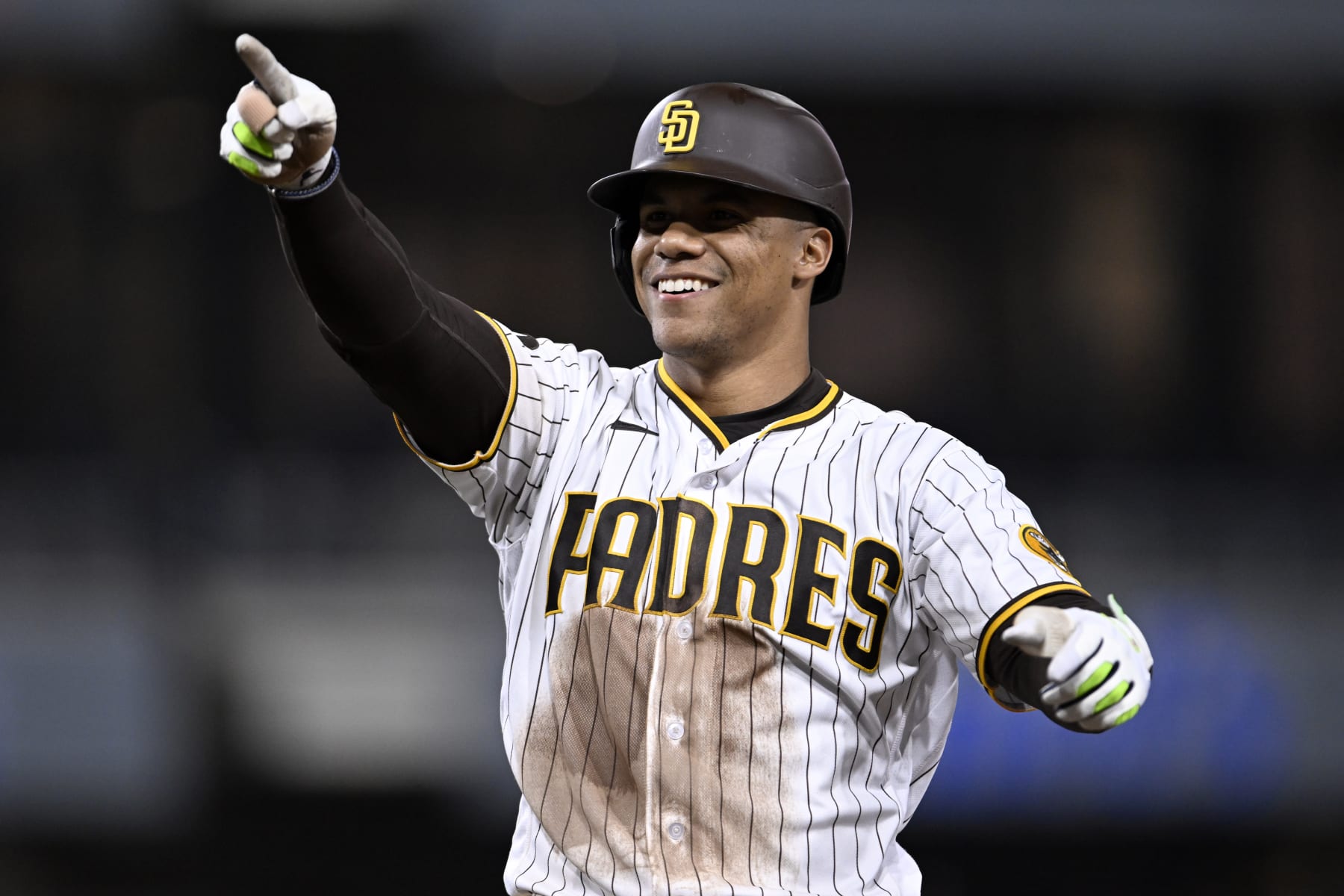 San Diego Padres' Juan Soto celebrates hitting a two-run single during the eighth inning of a baseball game against the Colorado Rockies in San Diego, Saturday, April 1, 2023. (AP Photo/Alex Gallardo)