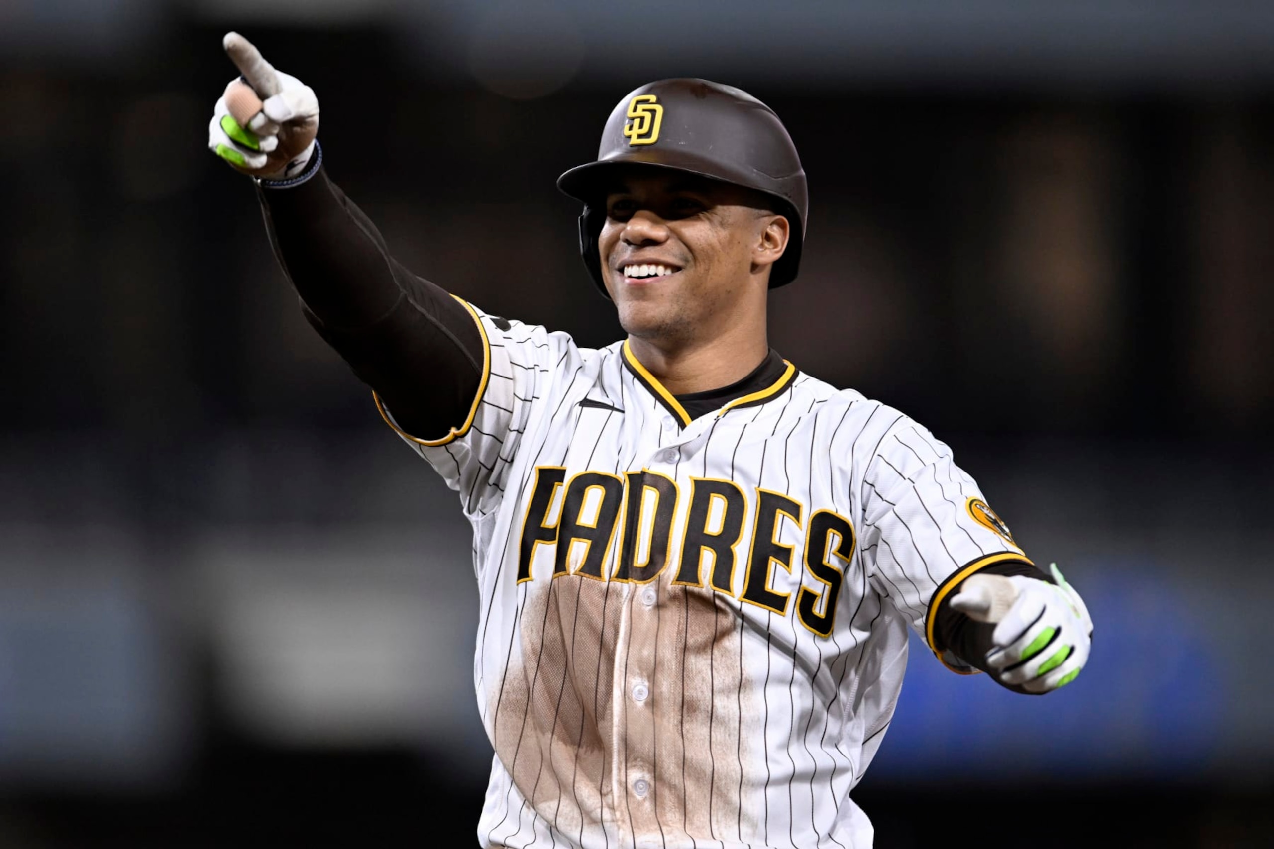 San Diego Padres' Juan Soto celebrates hitting a two-run single during the eighth inning of a baseball game against the Colorado Rockies in San Diego, Saturday, April 1, 2023. (AP Photo/Alex Gallardo)