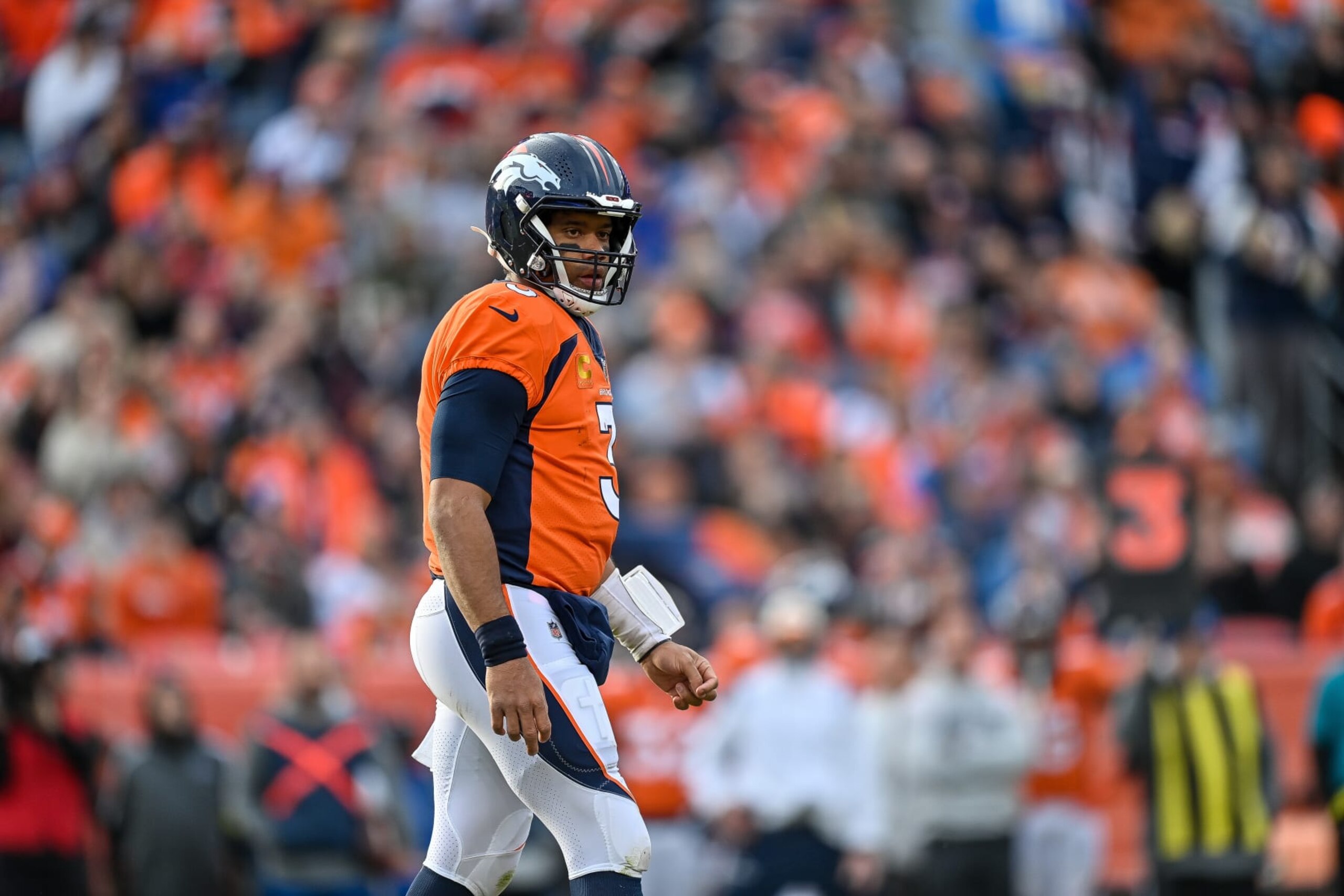 DENVER, CO - JANUARY 8: Denver Broncos quarterback Russell Wilson (3) looks on after a play during a game between the Los Angeles Chargers and the Denver Broncos at Empower Field at Mile High on January 8, 2023 in Denver, Colorado. (Photo by Dustin Bradford/Icon Sportswire via Getty Images)