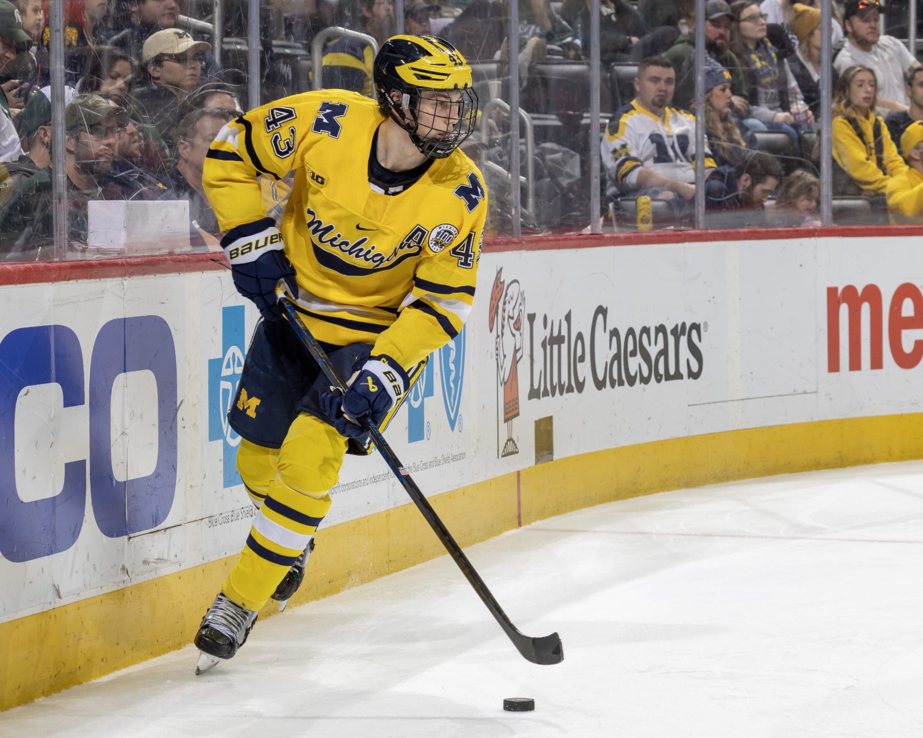 DETROIT, MI - FEBRUARY 11: Luke Hughes #43 of the Michigan Wolverines skates around the net with the puck against the Michigan State Spartans during the second period of an NCAA Mens college hockey Dual in the D game at Little Caesars Arena on February 11, 2023 in Detroit, Michigan. The Wolverines defeated the Spartans 4-3 in O.T. (Photo by Dave Reginek/Getty Images)