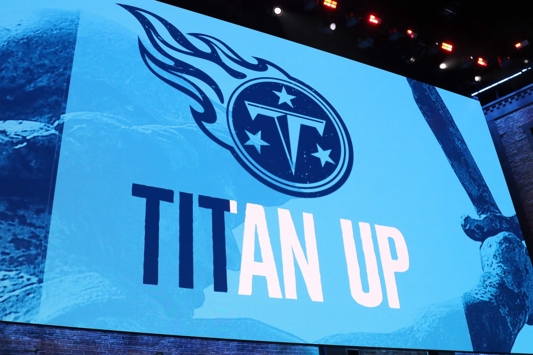 NASHVILLE, TN - APRIL 25:   The video board shows the logo for the Tennessee Titans during the first round of the 2019 NFL Draft on April 25, 2019, at the Draft Main Stage on Lower Broadway in downtown Nashville, TN.  (Photo by Michael Wade/Icon Sportswire via Getty Images)