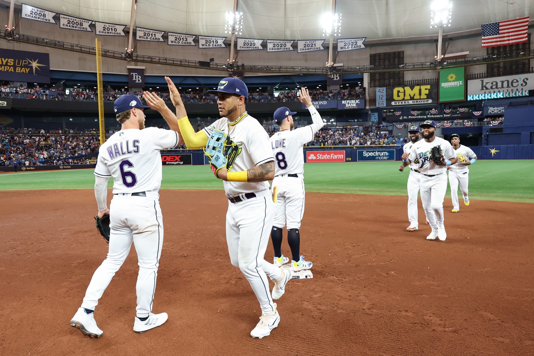 TAMPA, FL - MARCH 30:   Members of the Tampa Bay Rays celebrate after their opening day win over the Detroit Tigers at Tropicana Field on Thursday, March 30, 2023 in Tampa, Florida. (Photo by Mike Carlson/MLB Photos via Getty Images)