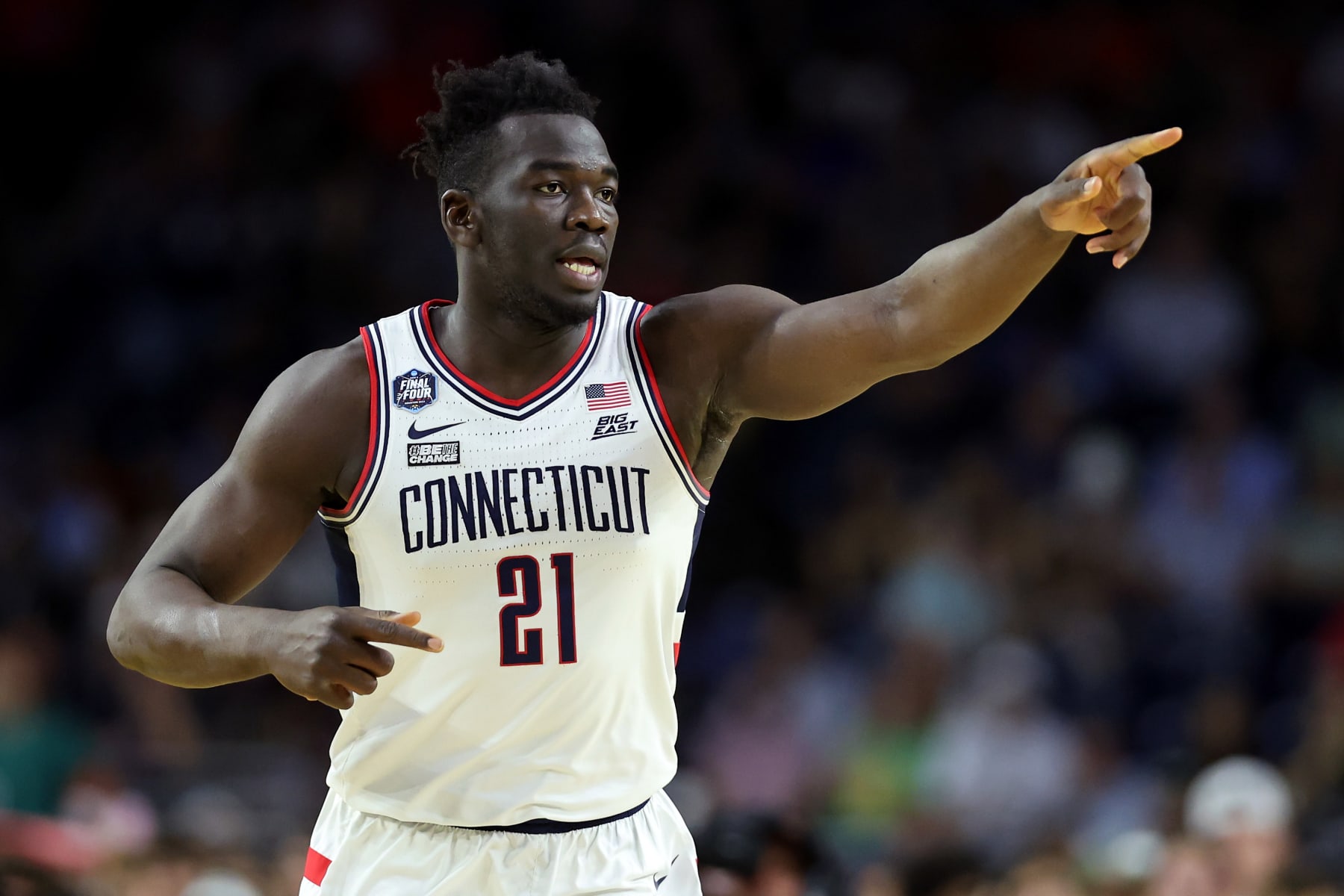 HOUSTON, TEXAS - APRIL 01: Adama Sanogo #21 of the Connecticut Huskies reacts during the first half against the Miami Hurricanes during the NCAA Men's Basketball Tournament Final Four semifinal game at NRG Stadium on April 01, 2023 in Houston, Texas. (Photo by Gregory Shamus/Getty Images)