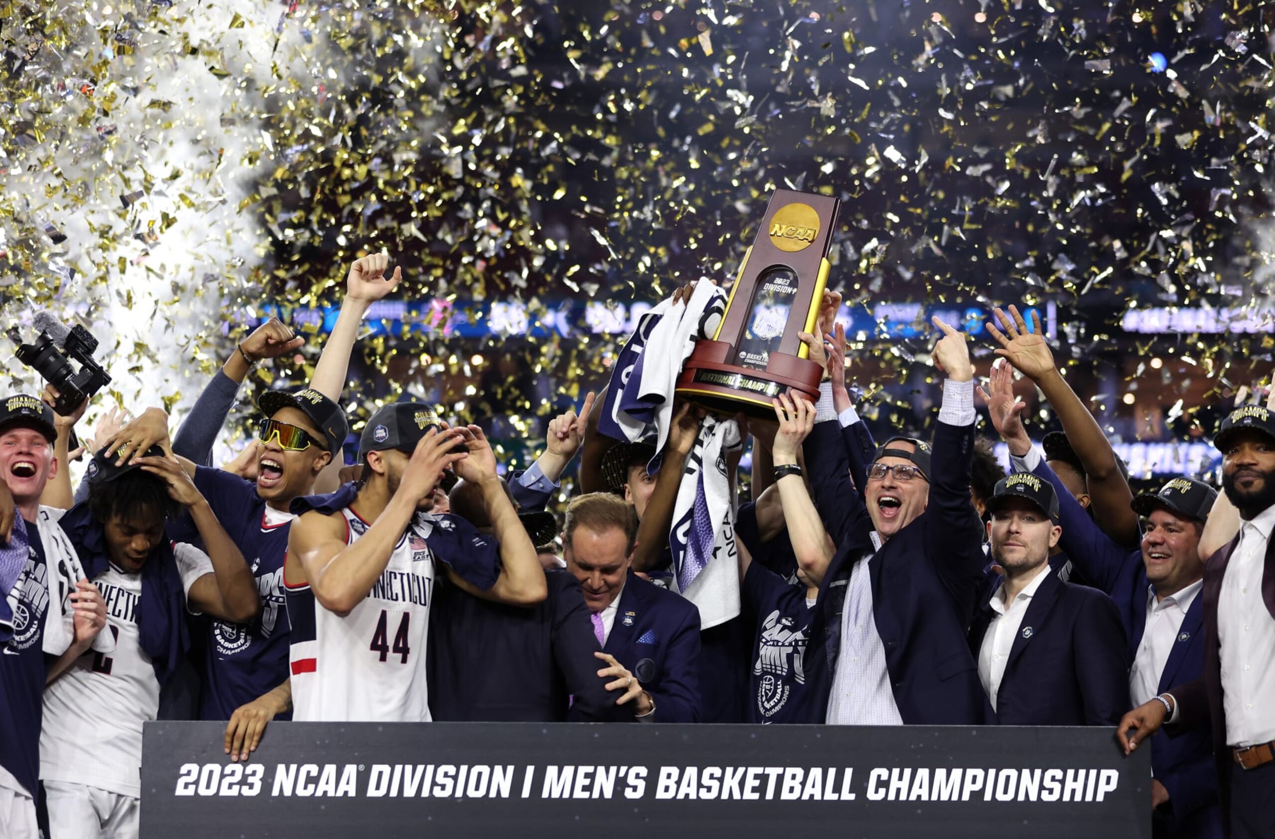 HOUSTON, TEXAS - APRIL 03: Head coach Dan Hurley of the Connecticut Huskies celebrates with his team after defeating the San Diego State Aztecs 76-59 during the NCAA Men's Basketball Tournament National Championship game at NRG Stadium on April 03, 2023 in Houston, Texas. (Photo by Gregory Shamus/Getty Images)