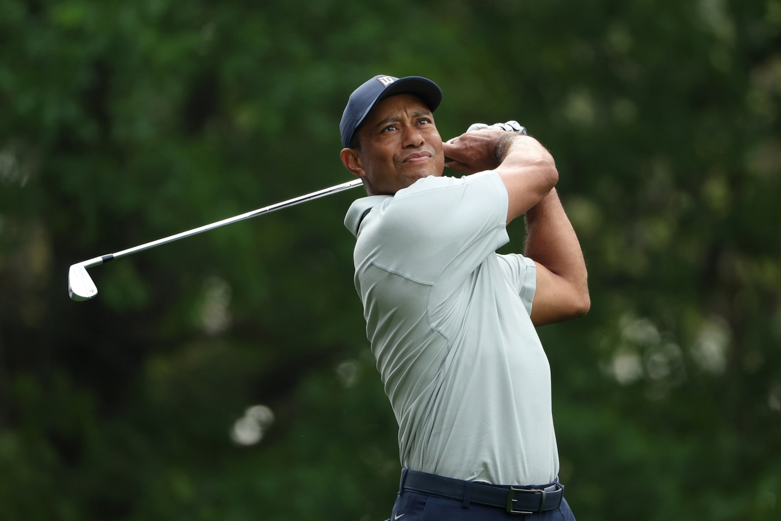 AUGUSTA, GEORGIA - APRIL 04: Tiger Woods of the United States plays his shot from the fourth tee during a practice round prior to the 2023 Masters Tournament at Augusta National Golf Club on April 04, 2023 in Augusta, Georgia. (Photo by Patrick Smith/Getty Images)