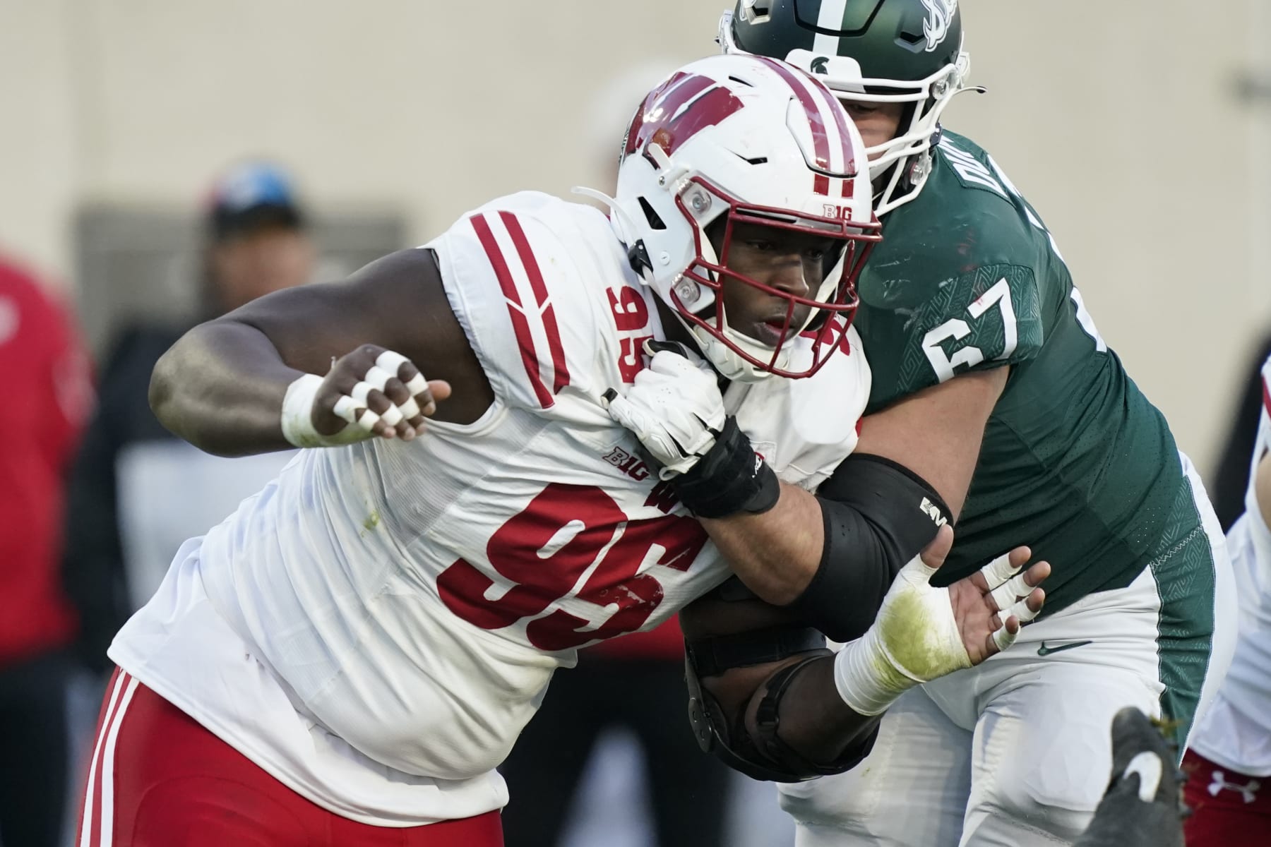 Wisconsin nose tackle Keeanu Benton plays during the second half of an NCAA college football game, Saturday, Oct. 15, 2022, in East Lansing, Mich. (AP Photo/Carlos Osorio) Wisconsin nose tackle Keeanu Benton plays during the second half of an NCAA college football game, Saturday, Oct. 15, 2022, in East Lansing, Mich. (AP Photo/Carlos Osorio)
