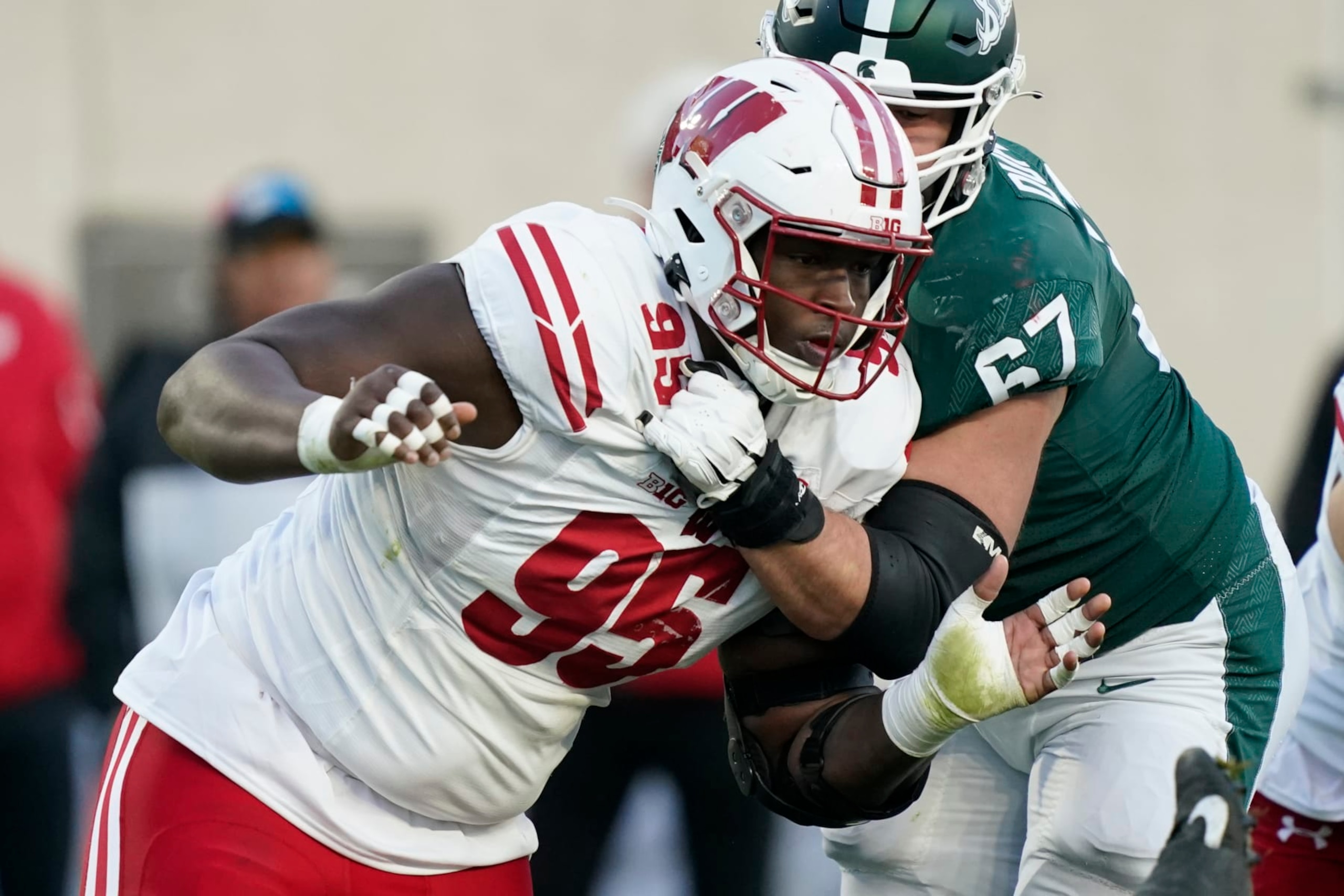 Wisconsin nose tackle Keeanu Benton plays during the second half of an NCAA college football game, Saturday, Oct. 15, 2022, in East Lansing, Mich. (AP Photo/Carlos Osorio)