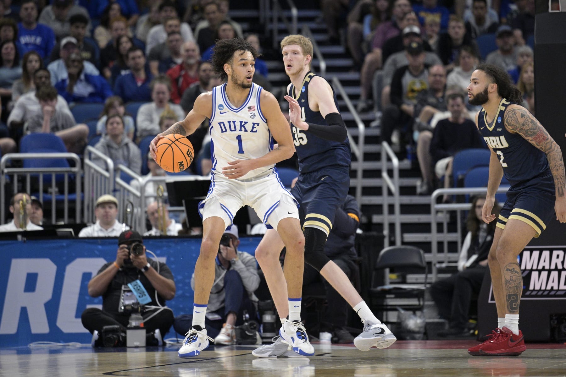 Duke center Dereck Lively II (1) is defended by Oral Roberts forward Connor Vanover (35) during the first half of a first-round college basketball game in the NCAA Tournament, Thursday, March 16, 2023, in Orlando, Fla. (AP Photo/Phelan M. Ebenhack)