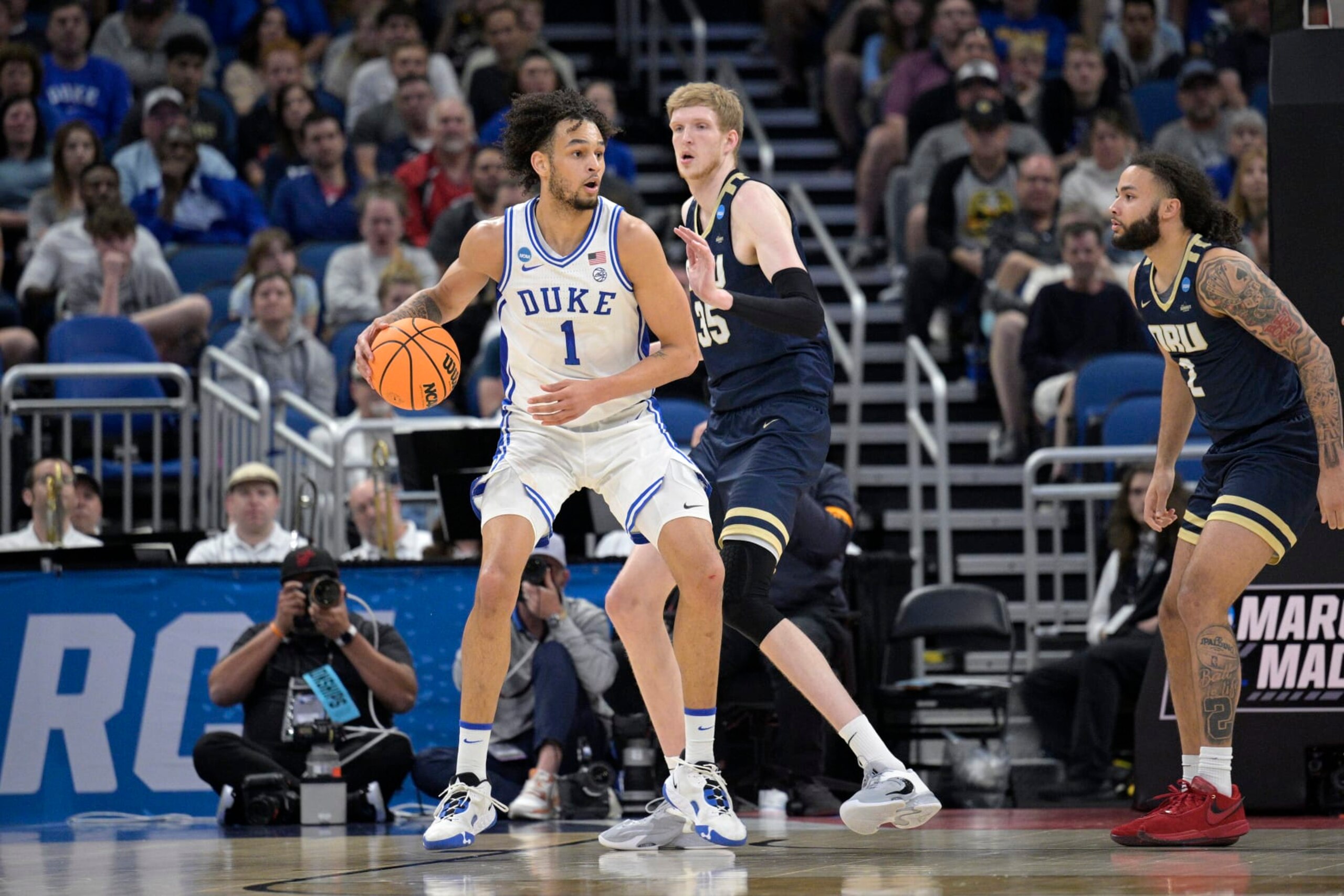 Duke center Dereck Lively II (1) is defended by Oral Roberts forward Connor Vanover (35) during the first half of a first-round college basketball game in the NCAA Tournament, Thursday, March 16, 2023, in Orlando, Fla. (AP Photo/Phelan M. Ebenhack)
