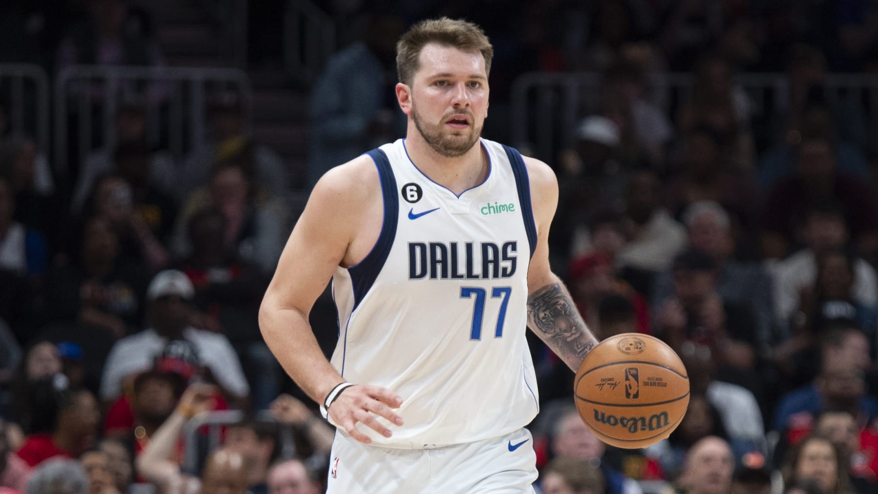 Dallas Mavericks guard Luka Doncic dribbles up court during the second half of an NBA basketball game against the Sunday, April 2, 2023, in Atlanta. (AP Photo/Hakim Wright Sr.)