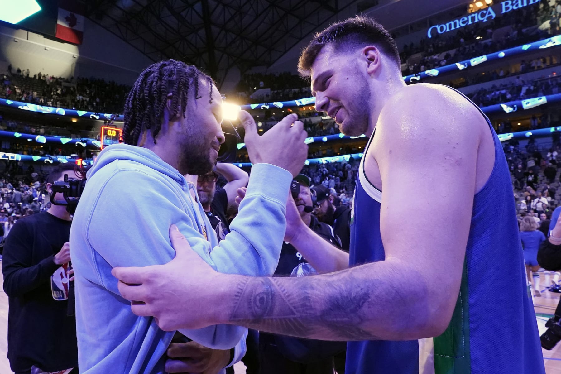 Dallas Mavericks guard Luka Doncic, right, and New York Knicks guard Jalen Brunson greet each other after an NBA basketball game in Dallas, Tuesday, Dec. 27, 2022. The Mavericks won in overtime 126-121. (AP Photo/LM Otero)