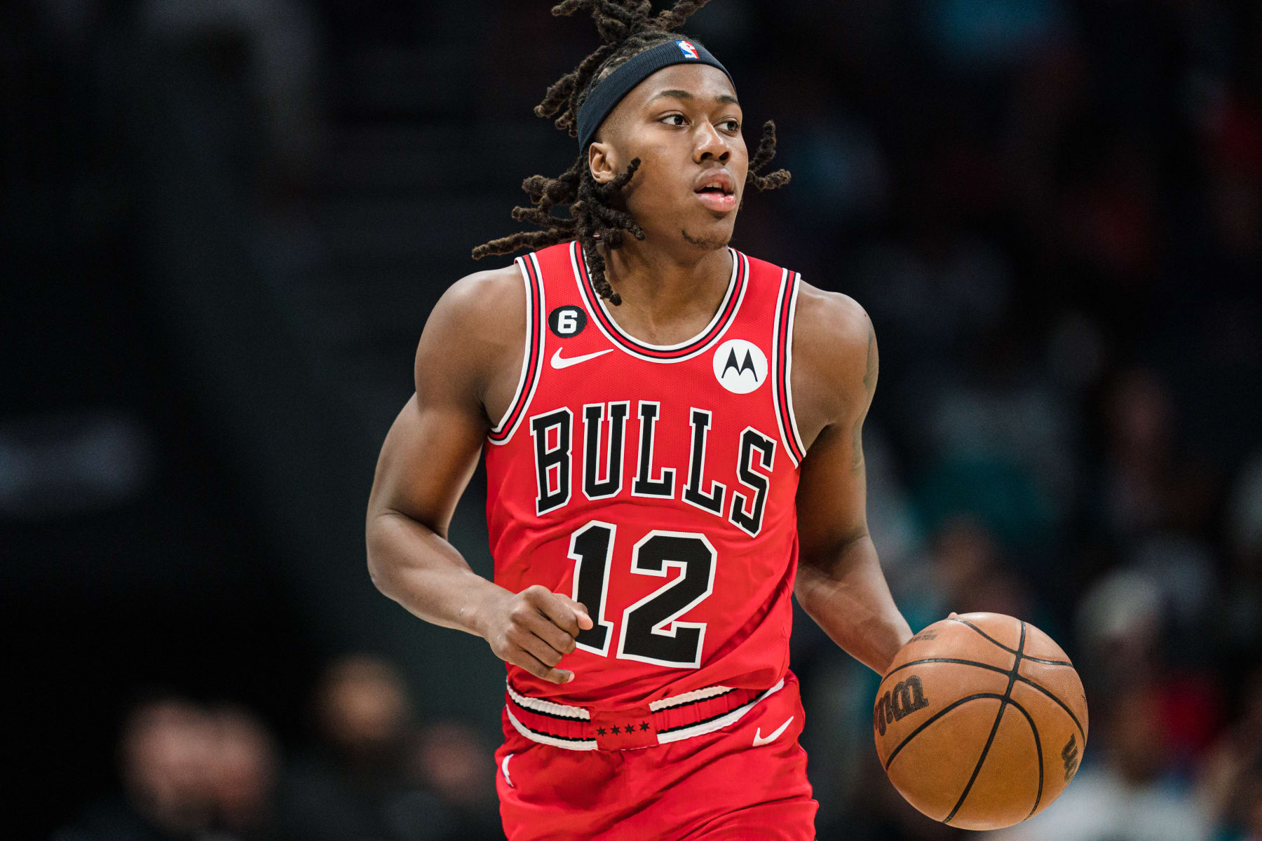 CHARLOTTE, NORTH CAROLINA - MARCH 31: Ayo Dosunmu #12 of the Chicago Bulls brings the ball up court against the Charlotte Hornets during their game at Spectrum Center on March 31, 2023 in Charlotte, North Carolina. NOTE TO USER: User expressly acknowledges and agrees that, by downloading and or using this photograph, User is consenting to the terms and conditions of the Getty Images License Agreement. (Photo by Jacob Kupferman/Getty Images)