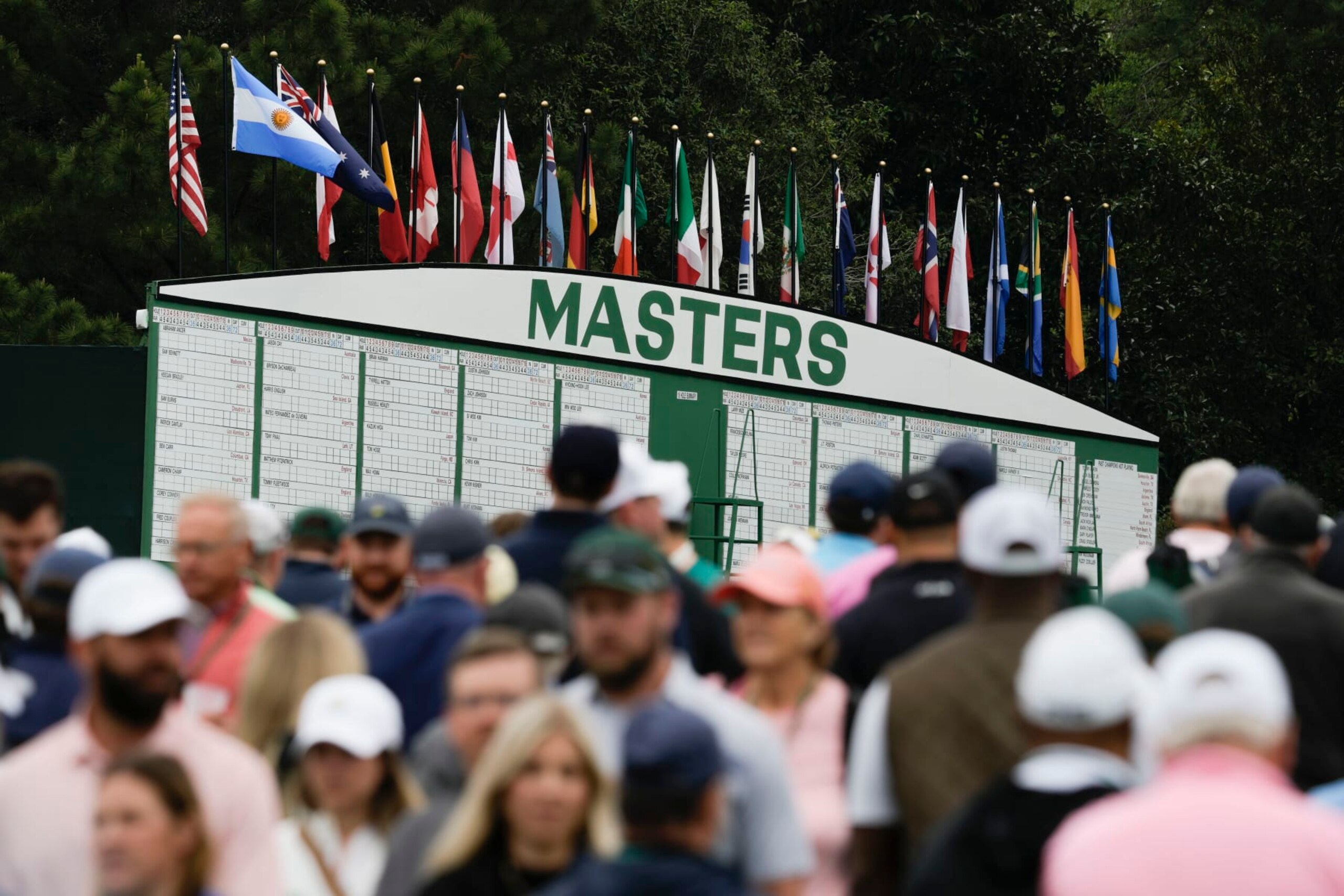 Patrons move on the course during a practice for the Masters golf tournament at Augusta National Golf Club, Monday, April 3, 2023, in Augusta, Ga. (AP Photo/Charlie Riedel)