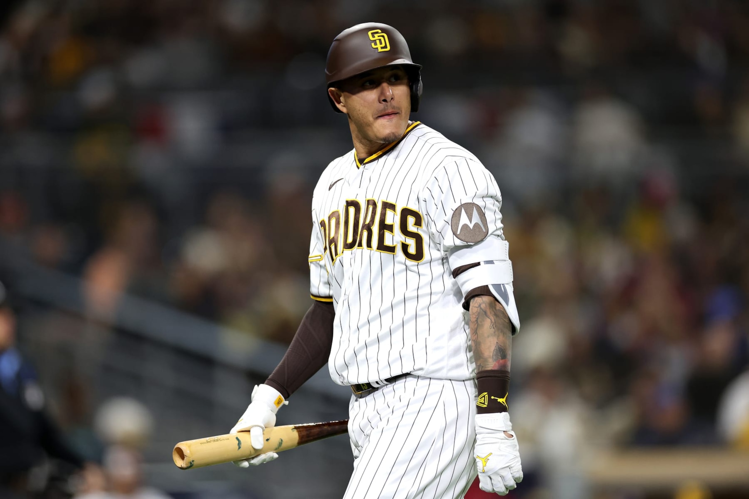 SAN DIEGO, CALIFORNIA - APRIL 03: Manny Machado #13 of the San Diego Padres reacts after flying out during the seventh inning of a game against the Arizona Diamondbacks at PETCO Park on April 03, 2023 in San Diego, California. (Photo by Sean M. Haffey/Getty Images)