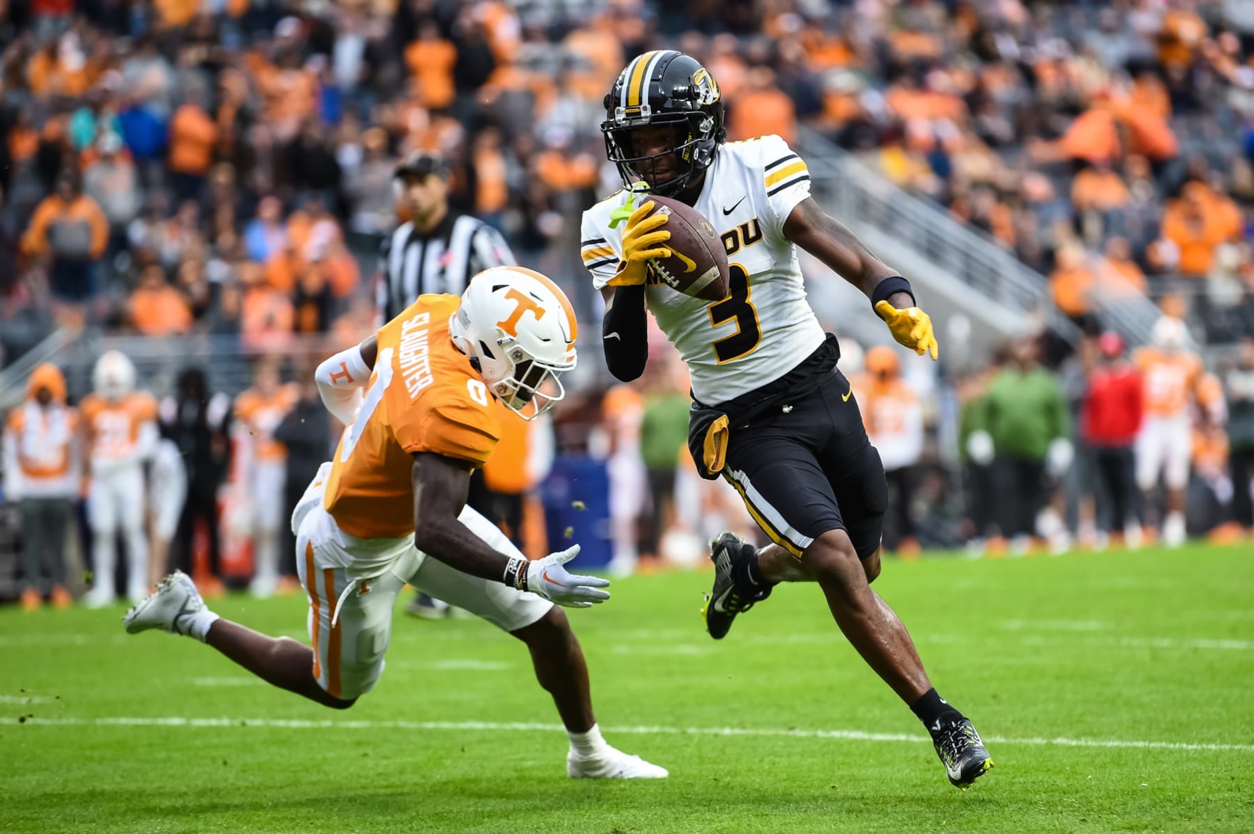 KNOXVILLE, TN - NOVEMBER 12: Missouri Tigers wide receiver Luther Burden III (3) runs past Tennessee Volunteers defensive back Doneiko Slaughter (0) during the college football game between the Tennessee Volunteers and the Missouri Tigers on November 12, 2022, at Neyland Stadium, in Knoxville, TN. (Photo by Bryan Lynn/Icon Sportswire via Getty Images)