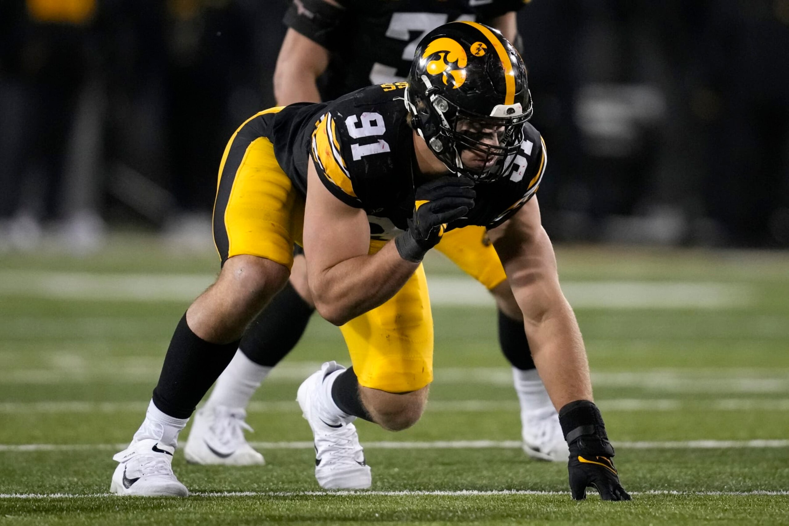 Iowa defensive lineman Lukas Van Ness gets set for a play during the second half of an NCAA college football game against Nebraska, Friday, Nov. 25, 2022, in Iowa City, Iowa. (AP Photo/Charlie Neibergall)