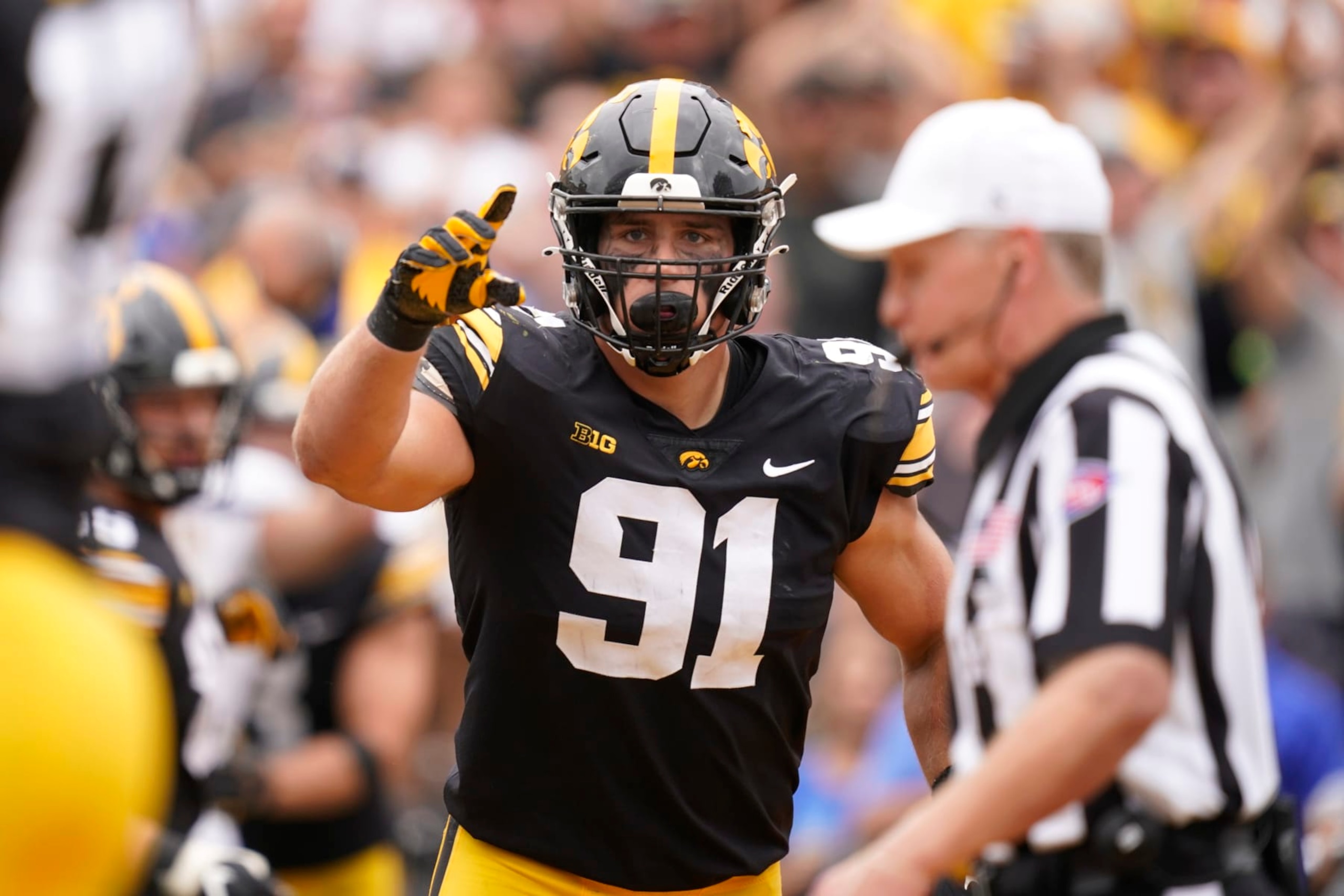 Iowa defensive lineman Lukas Van Ness (91) reacts after making a tackle during the second half of an NCAA college football game against South Dakota State, Saturday, Sept. 3, 2022, in Iowa City, Iowa. (AP Photo/Charlie Neibergall)