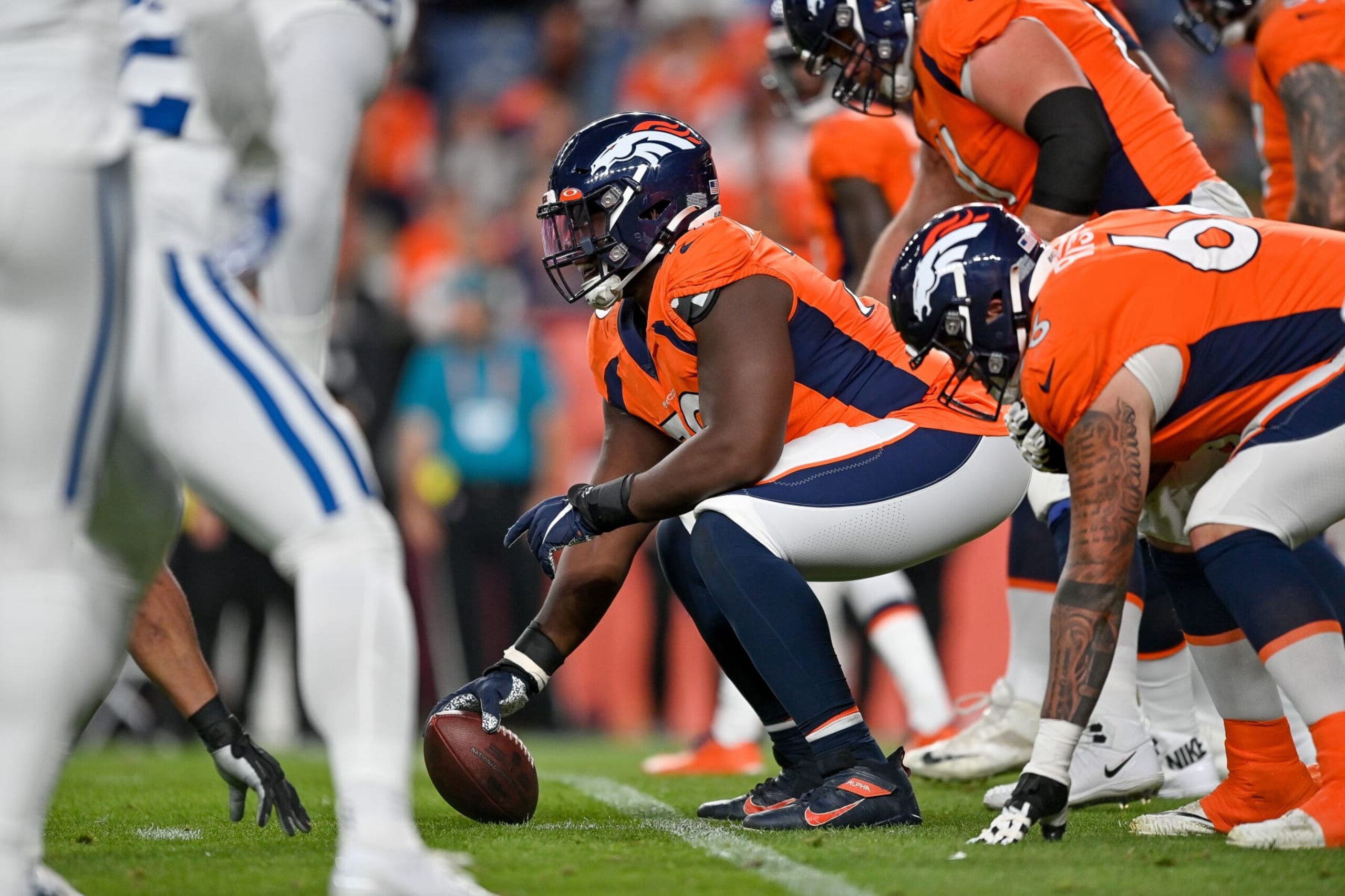 DENVER, COLORADO - OCTOBER 6:  The Denver Broncos offense lines up behind center Lloyd Cushenberry III #79 in the first half of a game against the Indianapolis Colts at Empower Field at Mile High on October 6, 2022 in Denver, Colorado. (Photo by Dustin Bradford/Getty Images)