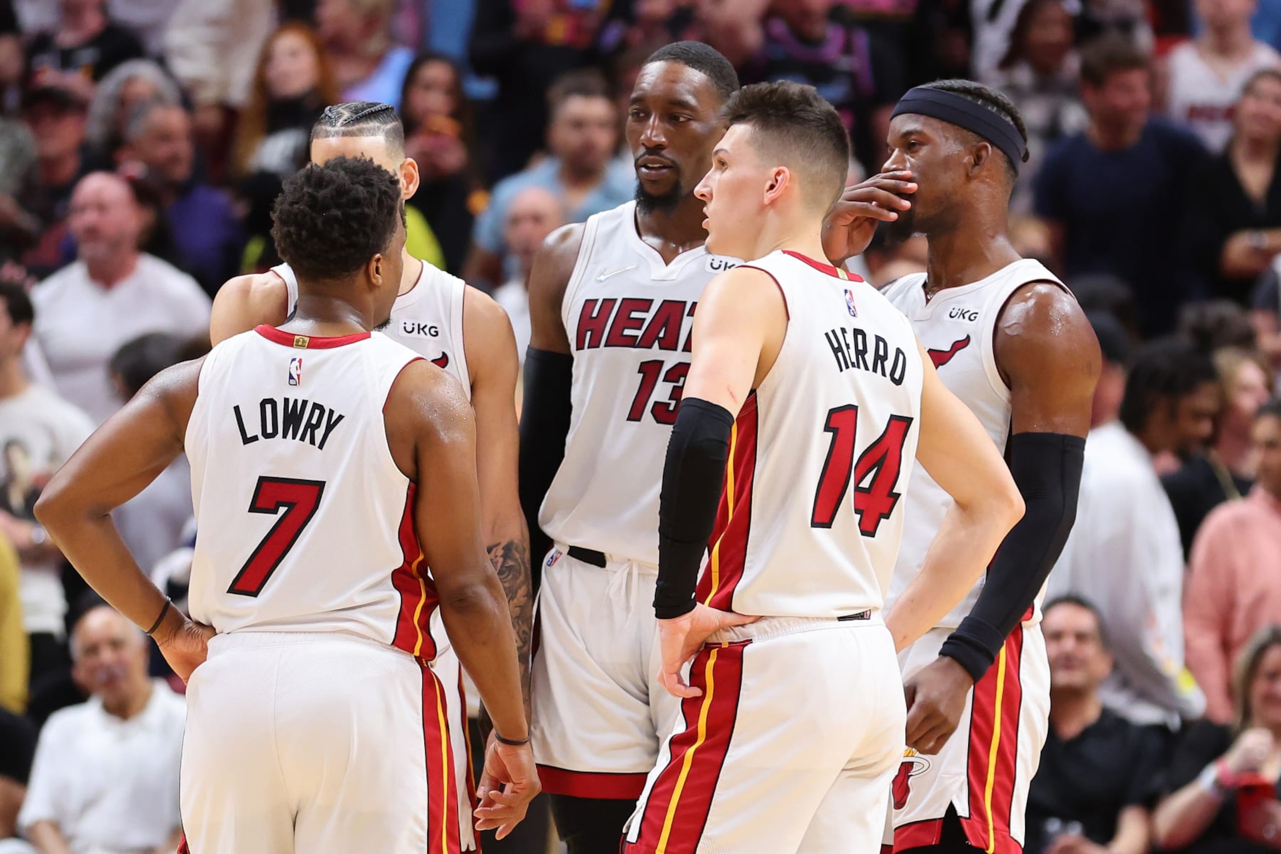 MIAMI, FLORIDA - APRIL 08: Kyle Lowry #7, Caleb Martin #16, Bam Adebayo #13, Tyler Herro #14 and Jimmy Butler #22 of the Miami Heat look on against the Atlanta Hawks during the second half at FTX Arena on April 08, 2022 in Miami, Florida. NOTE TO USER: User expressly acknowledges and agrees that, by downloading and or using this photograph, User is consenting to the terms and conditions of the Getty Images License Agreement.  (Photo by Michael Reaves/Getty Images)