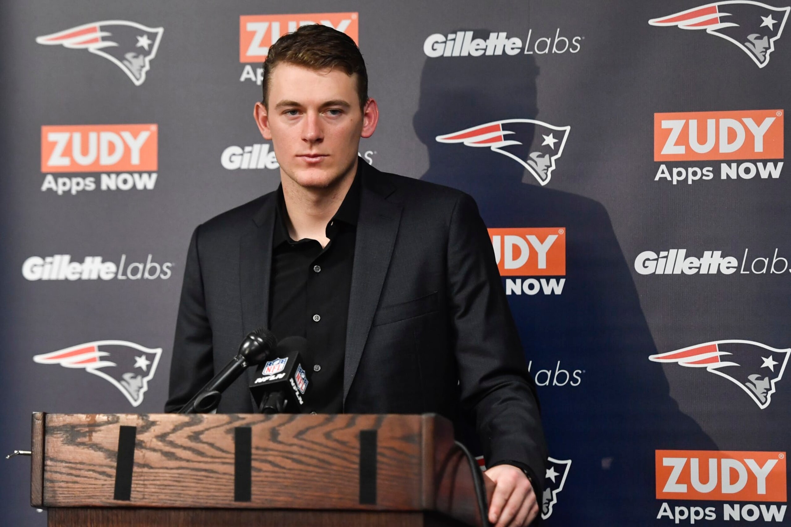New England Patriots quarterback Mac Jones (10) speaks during a news conference after their NFL football game against the Buffalo Bills, Sunday, Jan. 8, 2023, in Orchard Park. (AP Photo/Adrian Kraus)