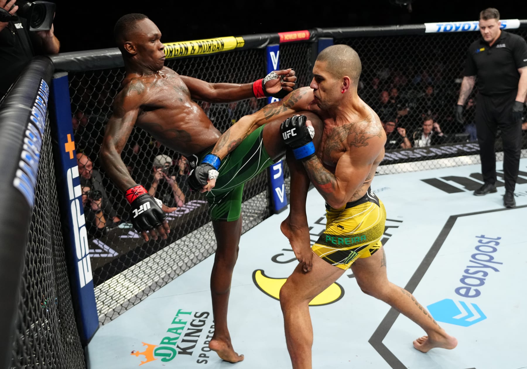 Israel Adesanya knees Alex Pereira in their first UFC fight.