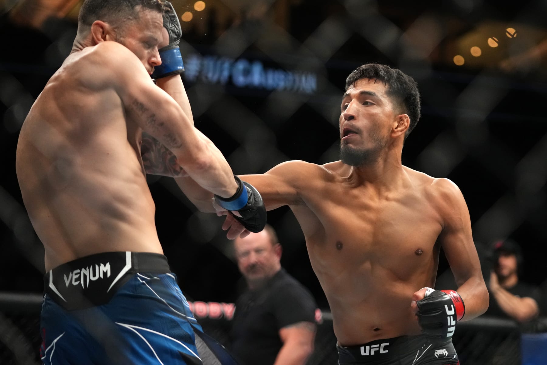 AUSTIN, TEXAS - JUNE 18: (R-L) Adrian Yanez punches Tony Kelley in a bantamweight fight during the UFC Fight Night event at Moody Center on June 18, 2022 in Austin, Texas. (Photo by Cooper Neill/Zuffa LLC)