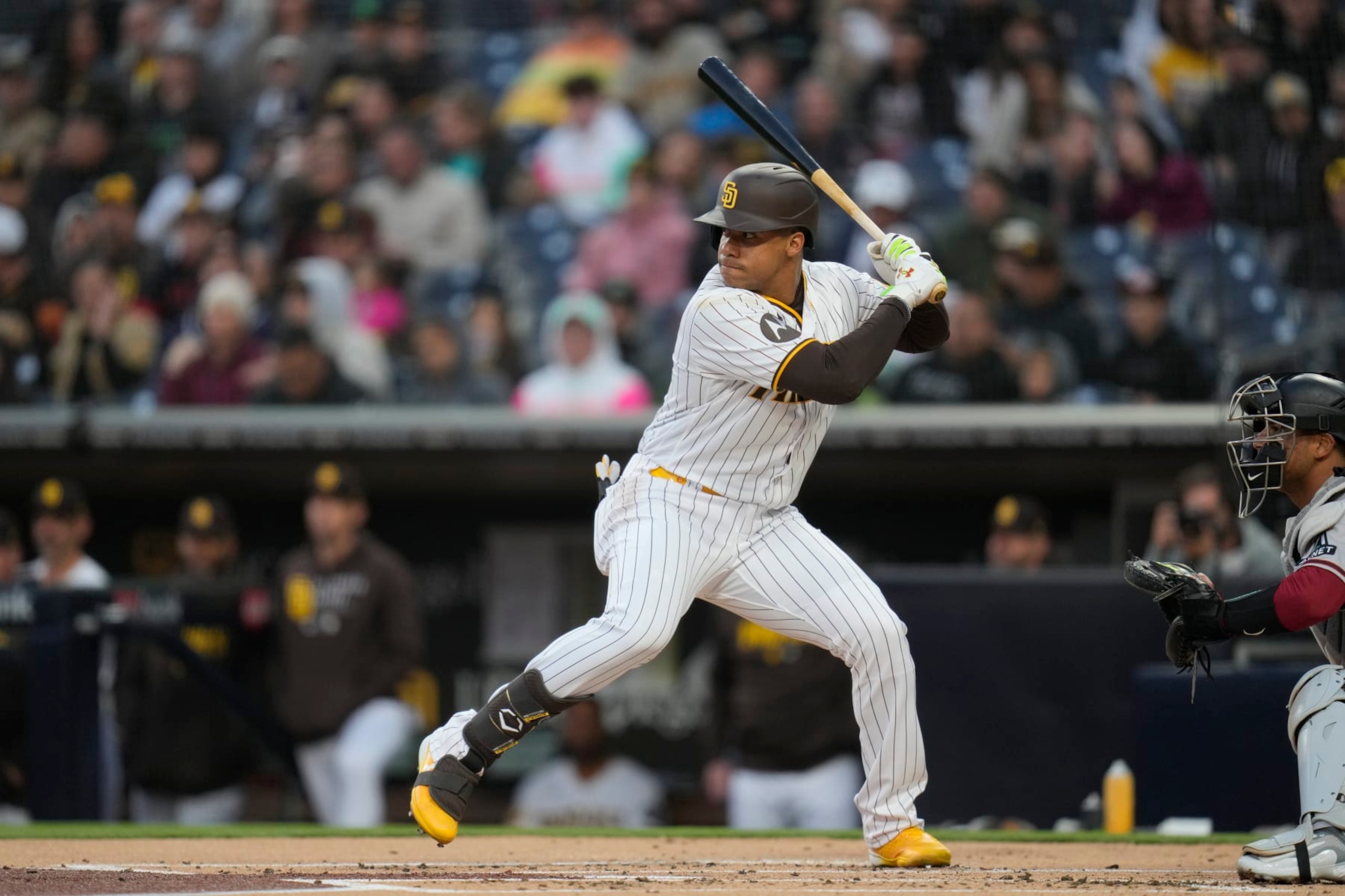San Diego Padres' Juan Soto bats during the first inning of a baseball game against the Arizona Diamondbacks, Monday, April 3, 2023, in San Diego. (AP Photo/Gregory Bull)