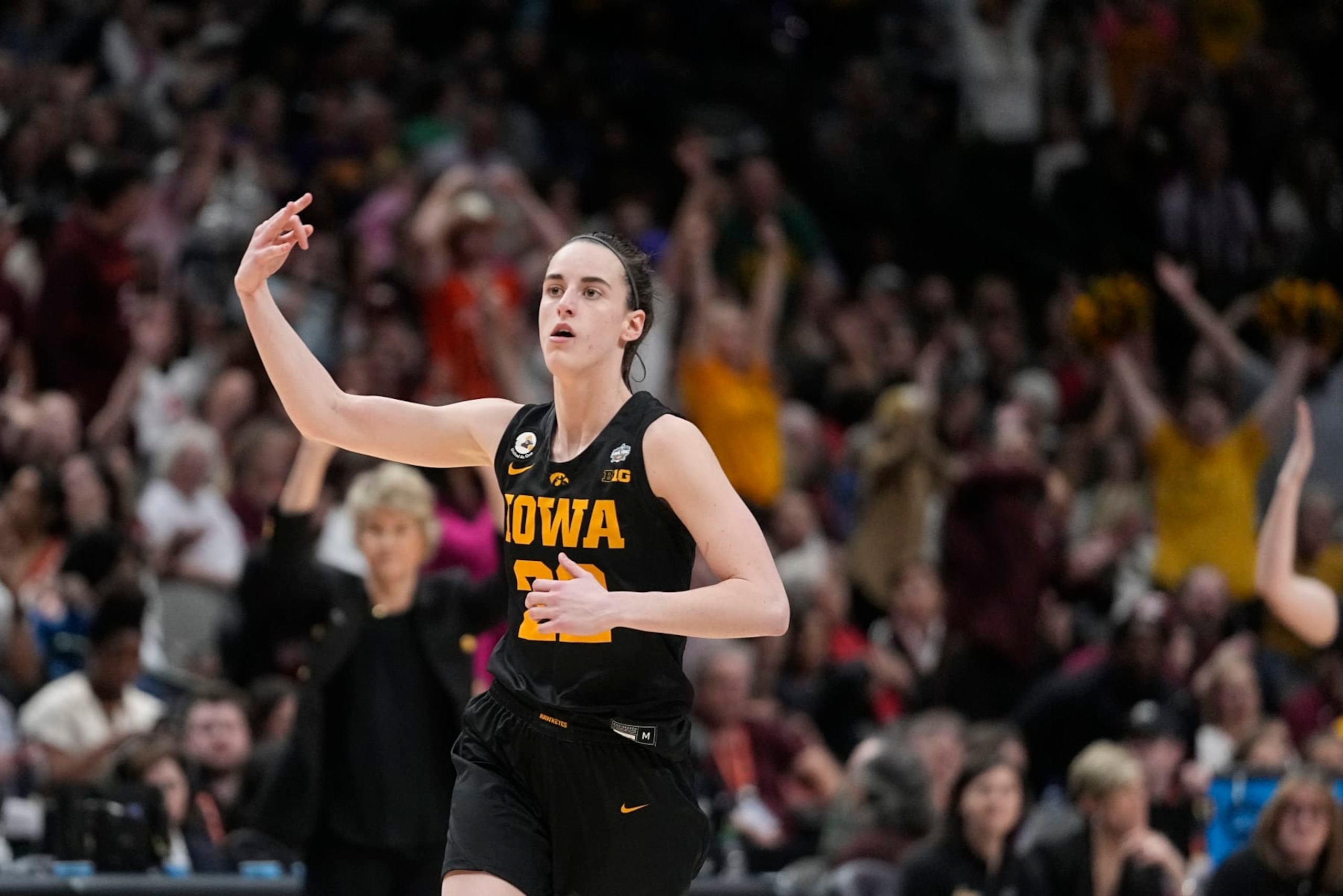 Iowa's Caitlin Clark reacts after a three pointer during the second half of an NCAA Women's Final Four semifinals basketball game against South Carolina Friday, March 31, 2023, in Dallas. (AP Photo/Darron Cummings) Iowa's Caitlin Clark reacts after a three pointer during the second half of an NCAA Women's Final Four semifinals basketball game against South Carolina Friday, March 31, 2023, in Dallas. (AP Photo/Darron Cummings)