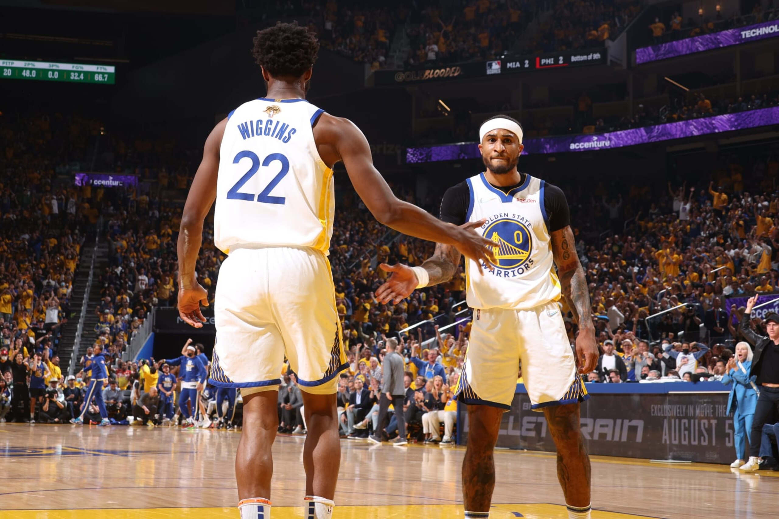 SAN FRANCISCO, CA - JUNE 13: Andrew Wiggins #22 and Gary Payton II #0 of the Golden State Warriors high five during Game Five of the 2022 NBA Finals on June 13, 2022 at Chase Center in San Francisco, California. NOTE TO USER: User expressly acknowledges and agrees that, by downloading and or using this photograph, user is consenting to the terms and conditions of Getty Images License Agreement. Mandatory Copyright Notice: Copyright 2022 NBAE (Photo by Nathaniel S. Butler/NBAE via Getty Images)