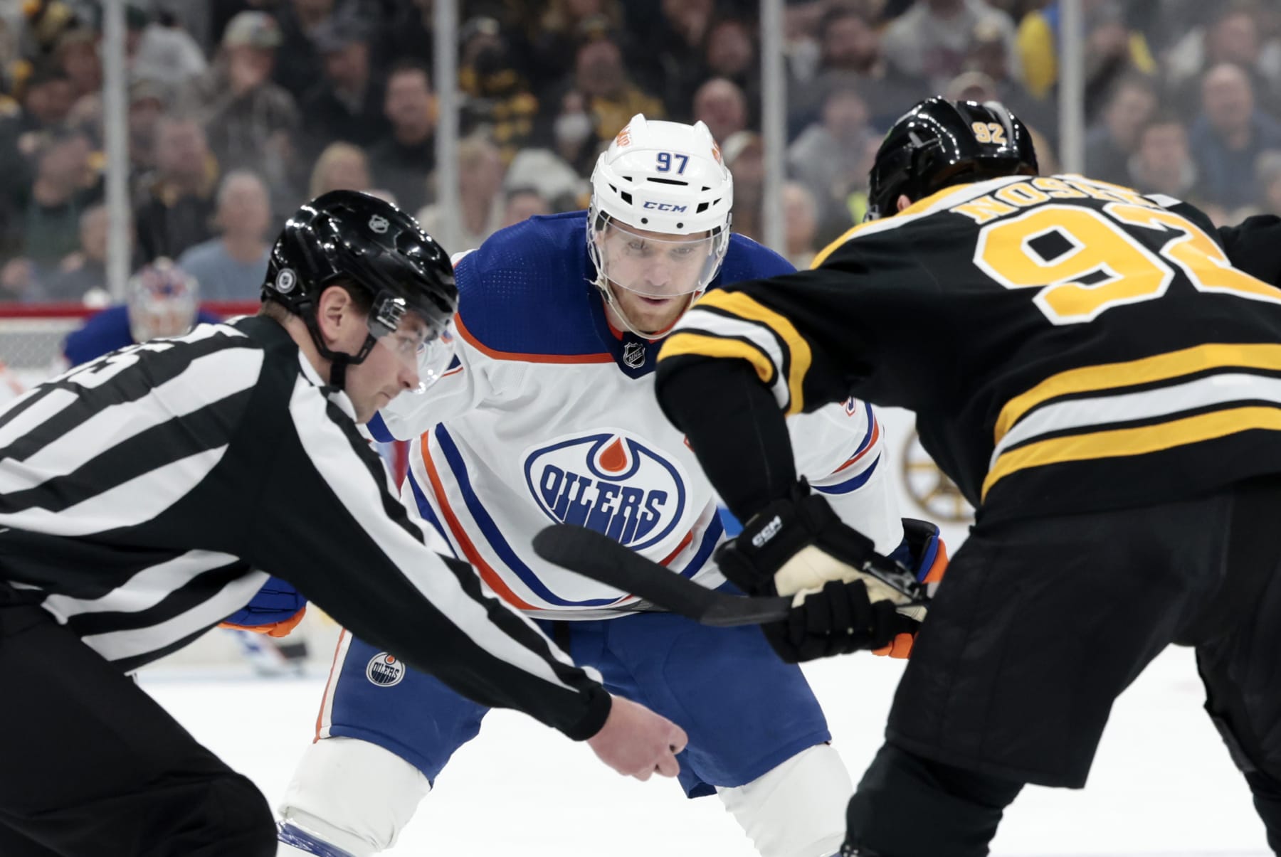 BOSTON, MA - MARCH 09: Edmonton Oilers center Connor McDavid (97) waits to take the draw from linesman Kyle Flemington (55) during a game between the Boston Bruins and the Edmonton Oilers on March 9, 2023, at TD garden in Boston, Massachusetts. (Photo by Fred Kfoury III/Icon Sportswire via Getty Images)