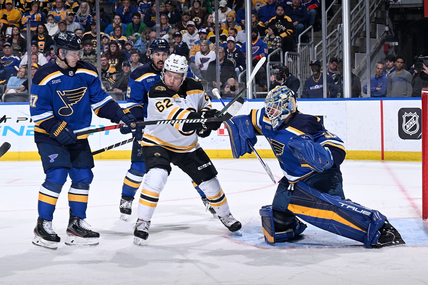 ST. LOUIS, MO - APRIL 2: Torey Krug #47 and Jordan Binnington #50 of the St. Louis Blues defend the net against Oskar Steen #62 of the Boston Bruins at the Enterprise Center on April 2, 2023 in St. Louis, Missouri. (Photo by Scott RovakNHLI via Getty Images)
