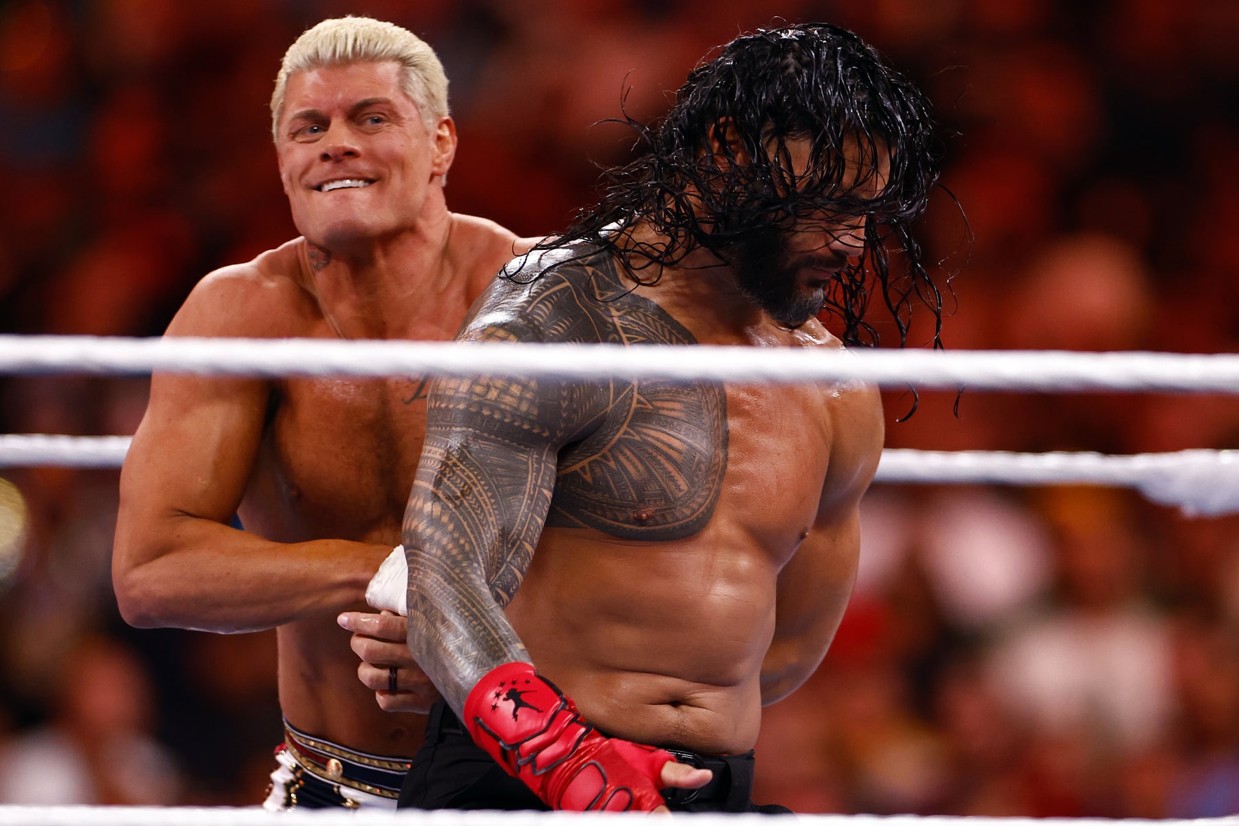 INGLEWOOD, CALIFORNIA - APRIL 02:  (L-R) Cody Rhodes wrestles Roman Reigns for Undisputed WWE Universal Title Match during WrestleMania Goes Hollywood at SoFi Stadium on April 02, 2023 in Inglewood, California.
 (Photo by Ronald Martinez/Getty Images)