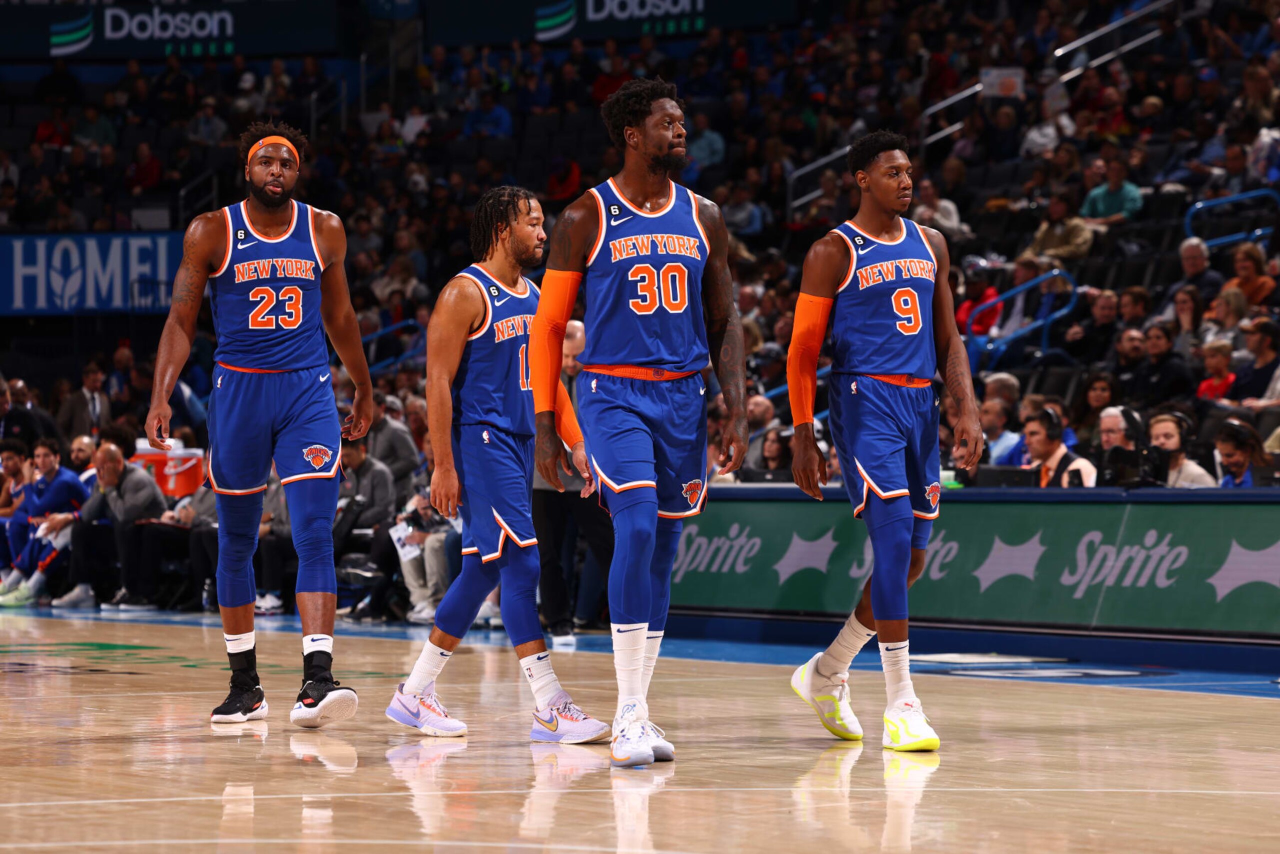 OKLAHOMA CITY, OK - NOVEMBER 21: Mitchell Robinson #23 of the New York Knicks, Jalen Brunson #11, Julius Randle #30, and RJ Barrett #9 stand on the court during the game against the Oklahoma City Thunder on November 21, 2022 at Paycom Arena in Oklahoma City, Oklahoma. NOTE TO USER: User expressly acknowledges and agrees that, by downloading and or using this photograph, User is consenting to the terms and conditions of the Getty Images License Agreement. Mandatory Copyright Notice: Copyright 2022 NBAE (Photo by Zach Beeker/NBAE via Getty Images)