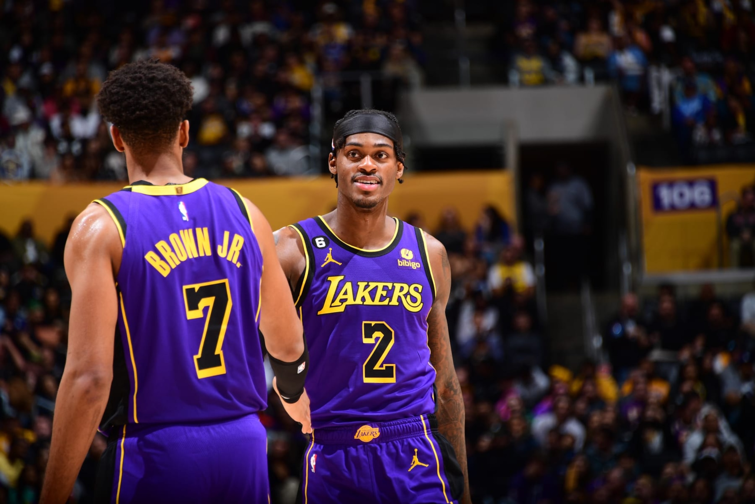 LOS ANGELES, CA - MARCH 24:  Troy Brown Jr. #7 and Jarred Vanderbilt #2 of the Los Angeles Lakers high five during the game on March 24, 2023 at Crypto.Com Arena in Los Angeles, California. NOTE TO USER: User expressly acknowledges and agrees that, by downloading and/or using this Photograph, user is consenting to the terms and conditions of the Getty Images License Agreement. Mandatory Copyright Notice: Copyright 2023 NBAE (Photo by Adam Pantozzi/NBAE via Getty Images)
