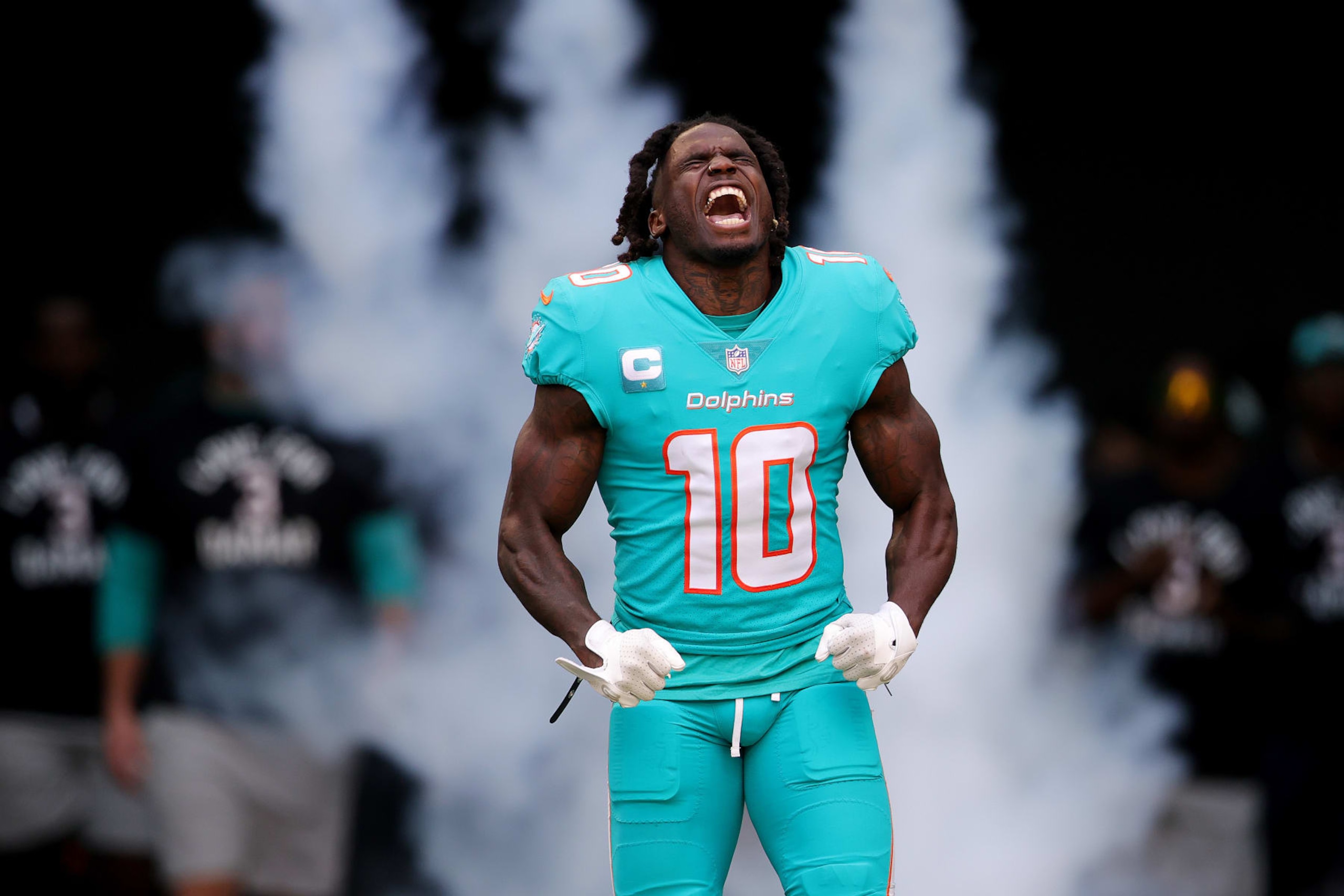 MIAMI GARDENS, FLORIDA - JANUARY 08: Tyreek Hill #10 of the Miami Dolphins yells while running onto the field prior to a game against the New York Jets at Hard Rock Stadium on January 08, 2023 in Miami Gardens, Florida. (Photo by Megan Briggs/Getty Images)