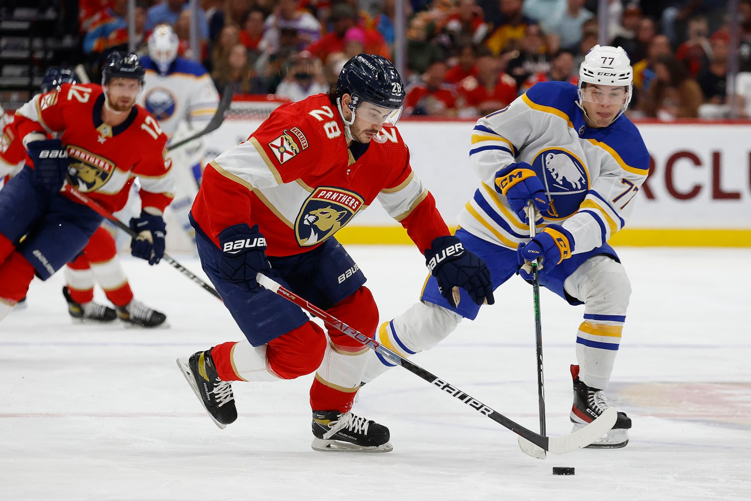 SUNRISE, FLORIDA - APRIL 4: Josh Mahura #28 of the Florida Panthers skates with the puck against JJ Peterka #77 of the Buffalo Sabres at the FLA Live Arena on April 4, 2023 in Sunrise, Florida. (Photo by Eliot J. Schechter/NHLI via Getty Images) SUNRISE, FLORIDA - APRIL 4: Josh Mahura #28 of the Florida Panthers skates with the puck against JJ Peterka #77 of the Buffalo Sabres at the FLA Live Arena on April 4, 2023 in Sunrise, Florida. (Photo by Eliot J. Schechter/NHLI via Getty Images)