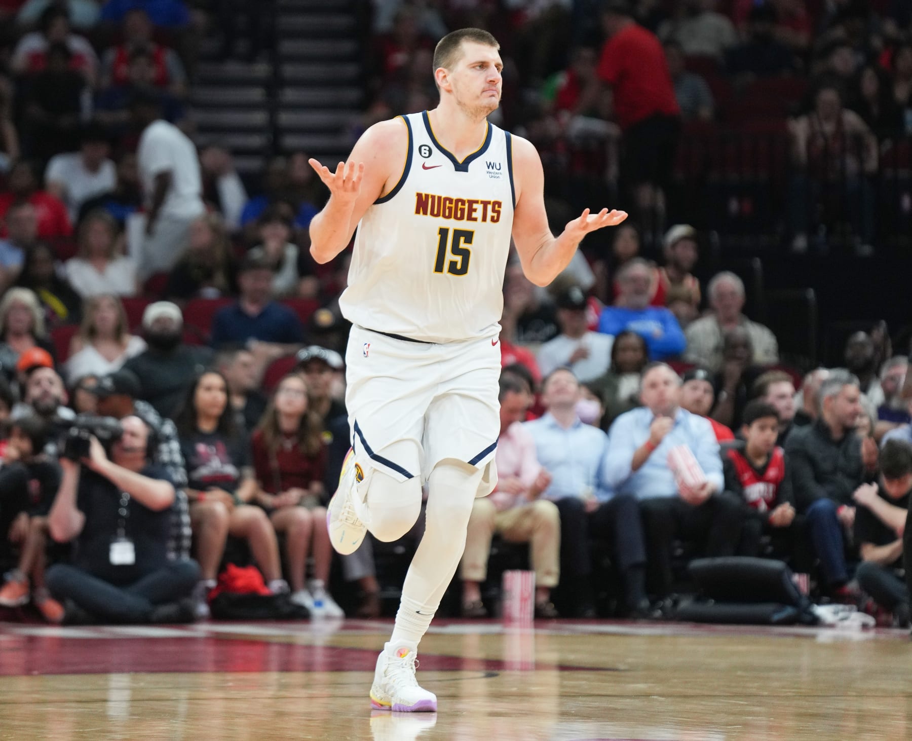 HOUSTON, TEXAS - APRIL 04: Nikola Jokic #15 of the Denver Nuggets reacts after making a shot during the first half of the game against the Houston Rockets at Toyota Center on April 04, 2023 in Houston, Texas. NOTE TO USER: User expressly acknowledges and agrees that, by downloading and or using this photograph, User is consenting to the terms and conditions of the Getty Images License Agreement.  (Photo by Alex Bierens de Haan/Getty Images)