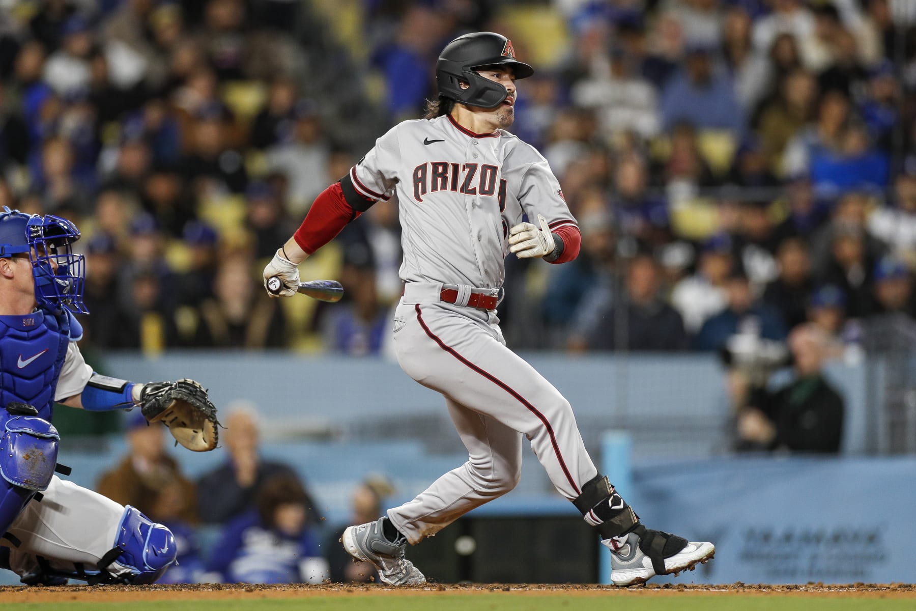 LOS ANGELES, CA - MARCH 31: Arizona Diamondbacks center fielder Corbin Carroll (7) tracks his ball in flight during a regular season game between the Arizona Diamondbacks and Los Angeles Dodgers on March 31, 2023, at Dodger Stadium in Los Angeles, CA. (Photo by Brandon Sloter/Icon Sportswire via Getty Images)