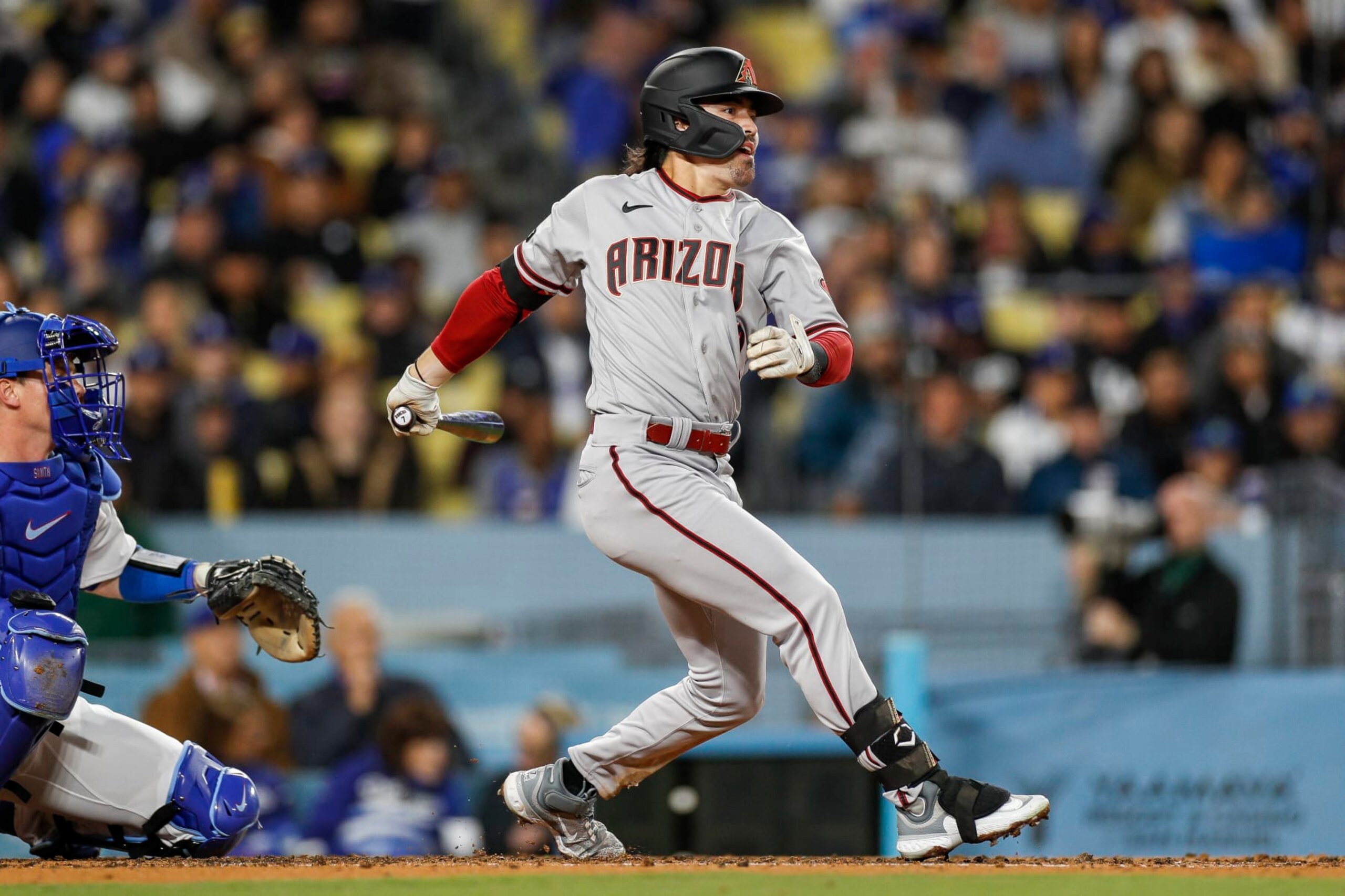 LOS ANGELES, CA - MARCH 31: Arizona Diamondbacks center fielder Corbin Carroll (7) tracks his ball in flight during a regular season game between the Arizona Diamondbacks and Los Angeles Dodgers on March 31, 2023, at Dodger Stadium in Los Angeles, CA. (Photo by Brandon Sloter/Icon Sportswire via Getty Images)